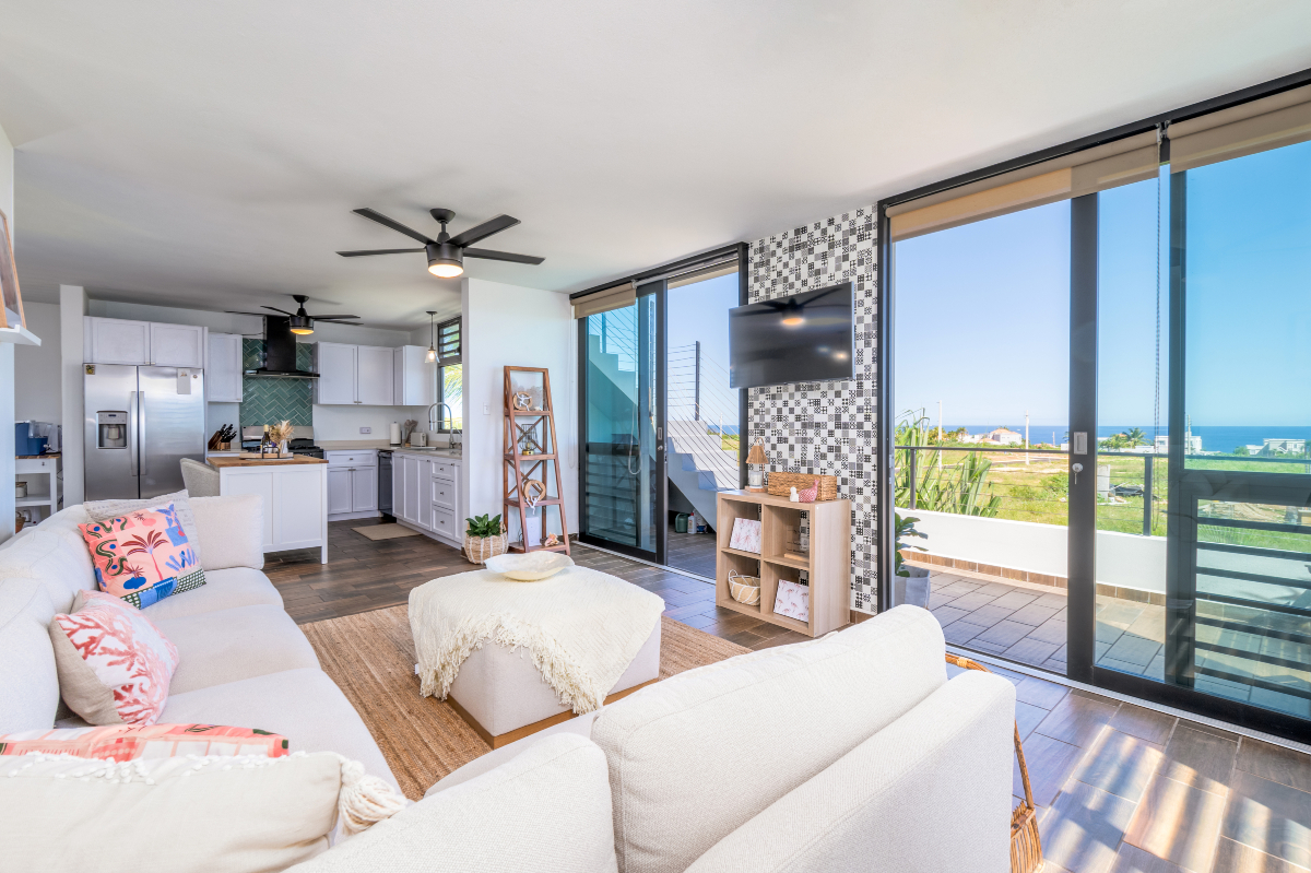 Casa - Cozy up with a view! This modern, sun-soaked living room opens ...
