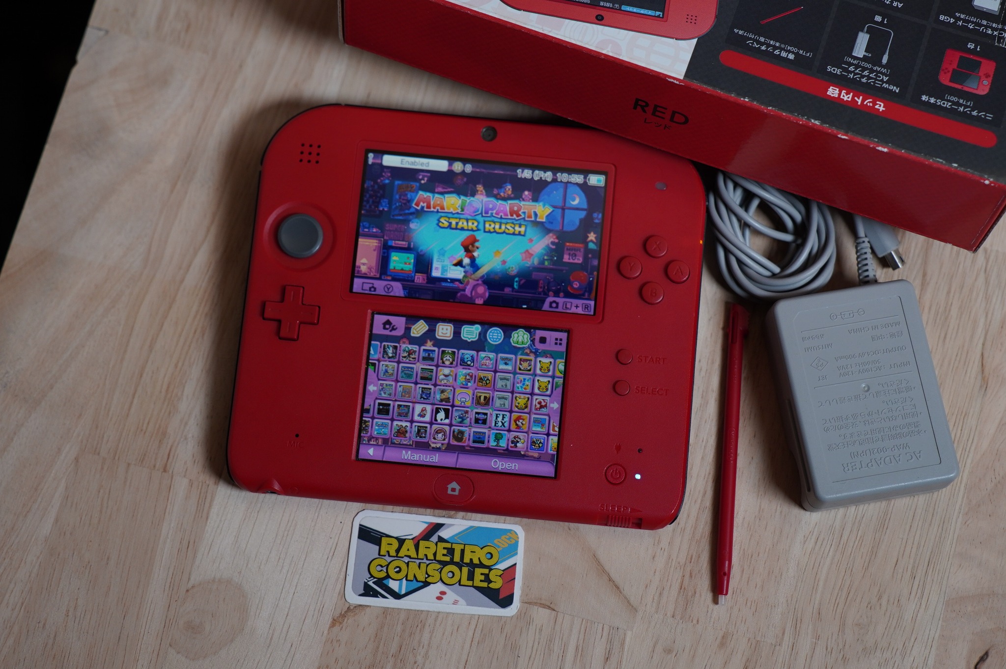 What was the handheld console with foldable middle and dark red
