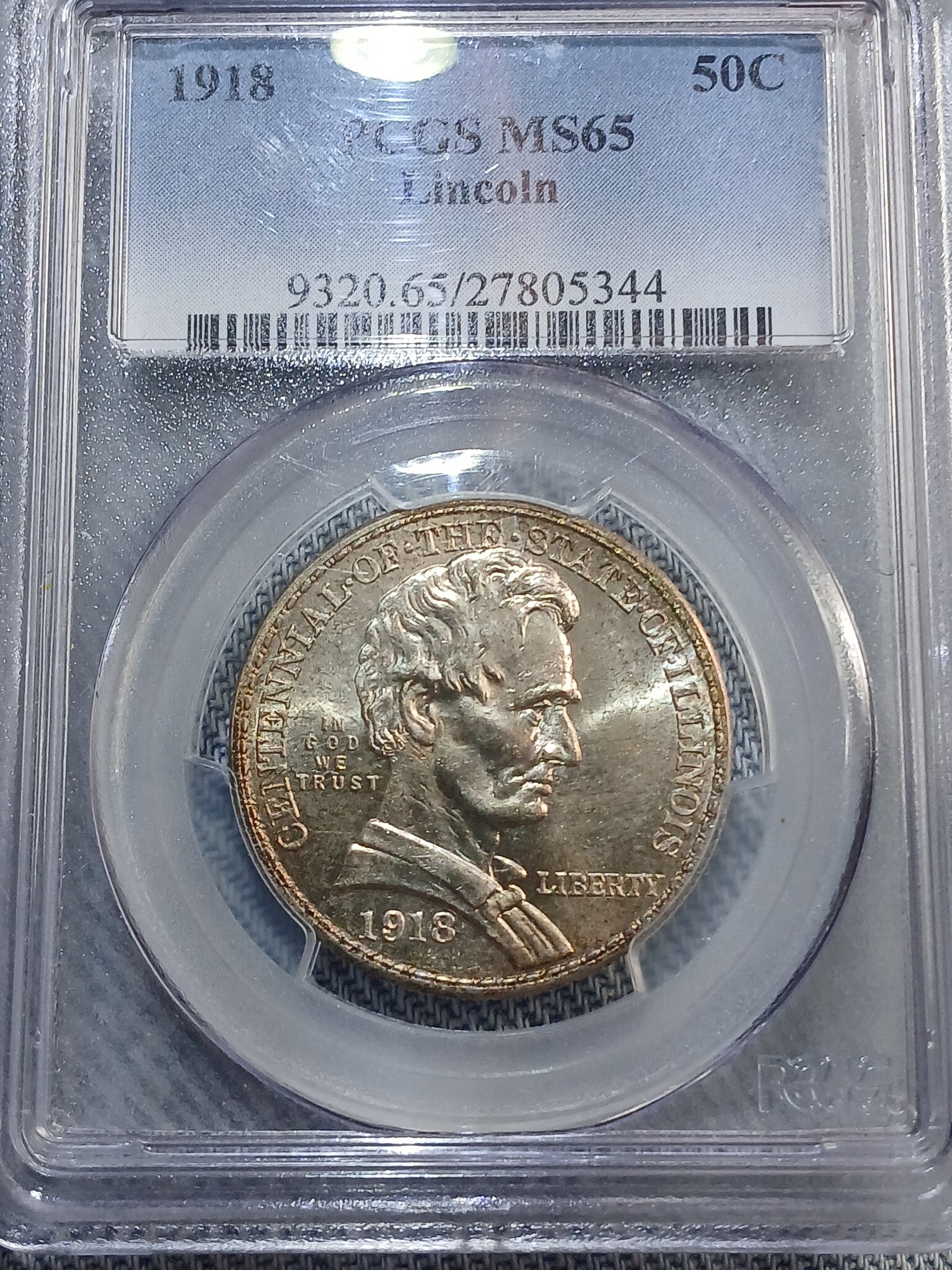 What do the letters and numbers on coins signify?