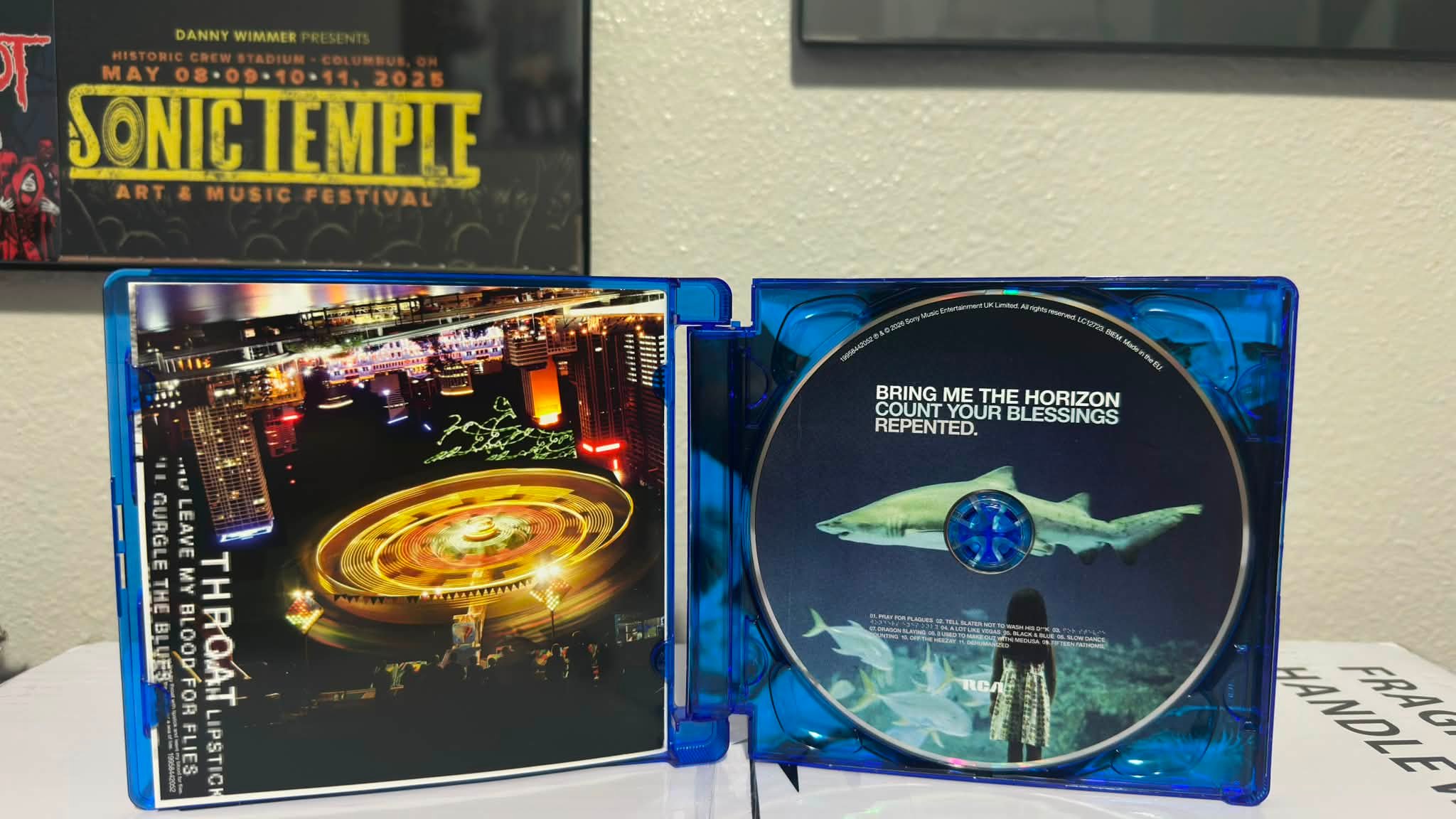 Did Bring Me The Horizon deluxe CD come with a sticker?