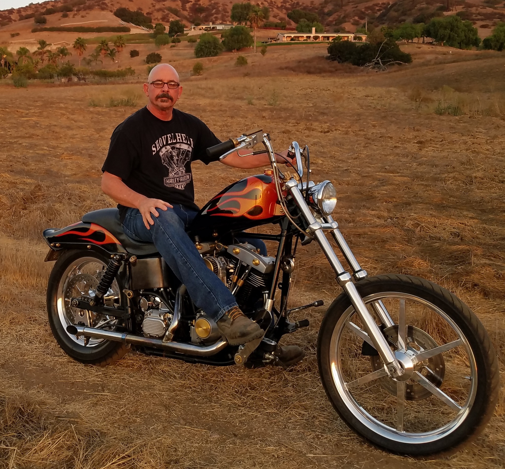 Customized 1984 FXSB motorcycle with side pipes