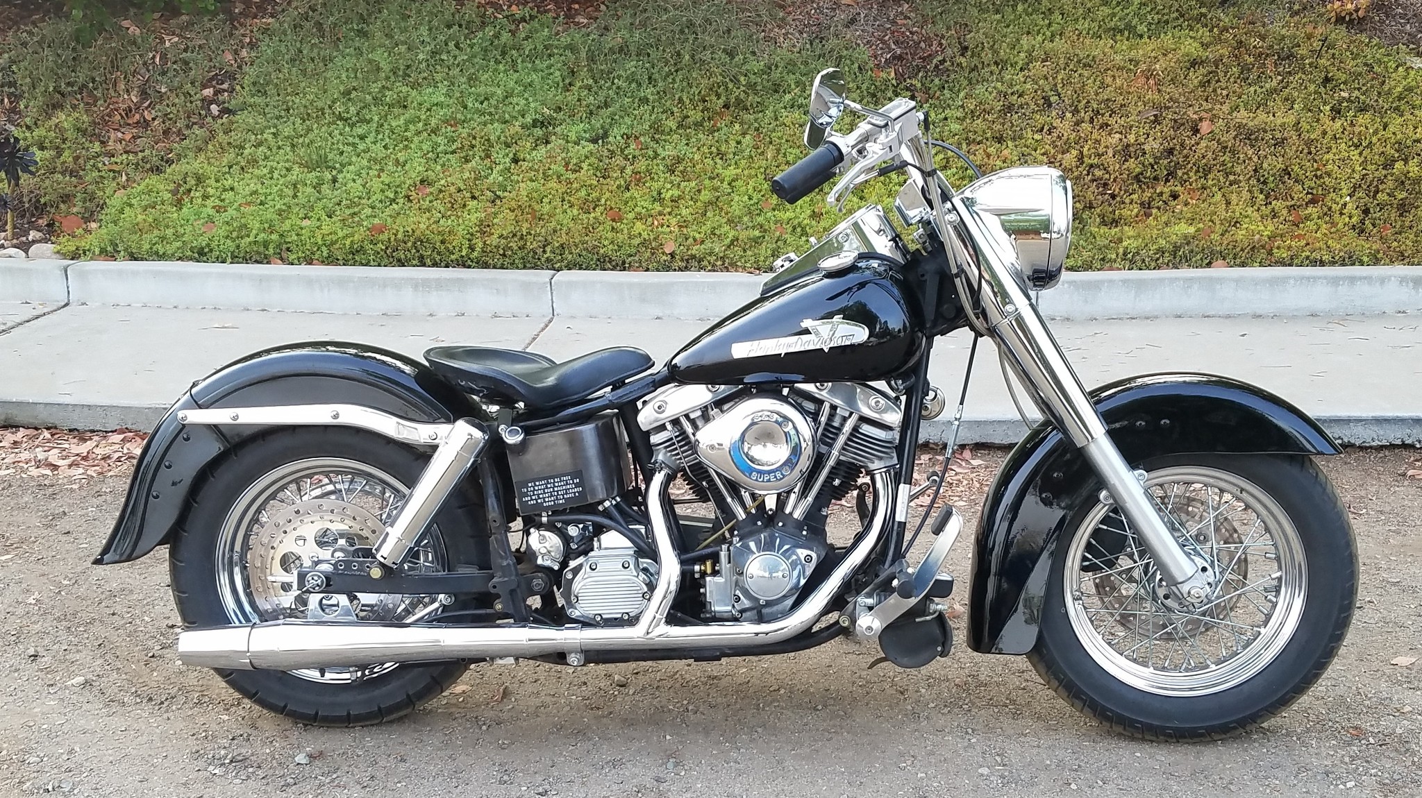 Customized 1984 FXSB motorcycle with side pipes