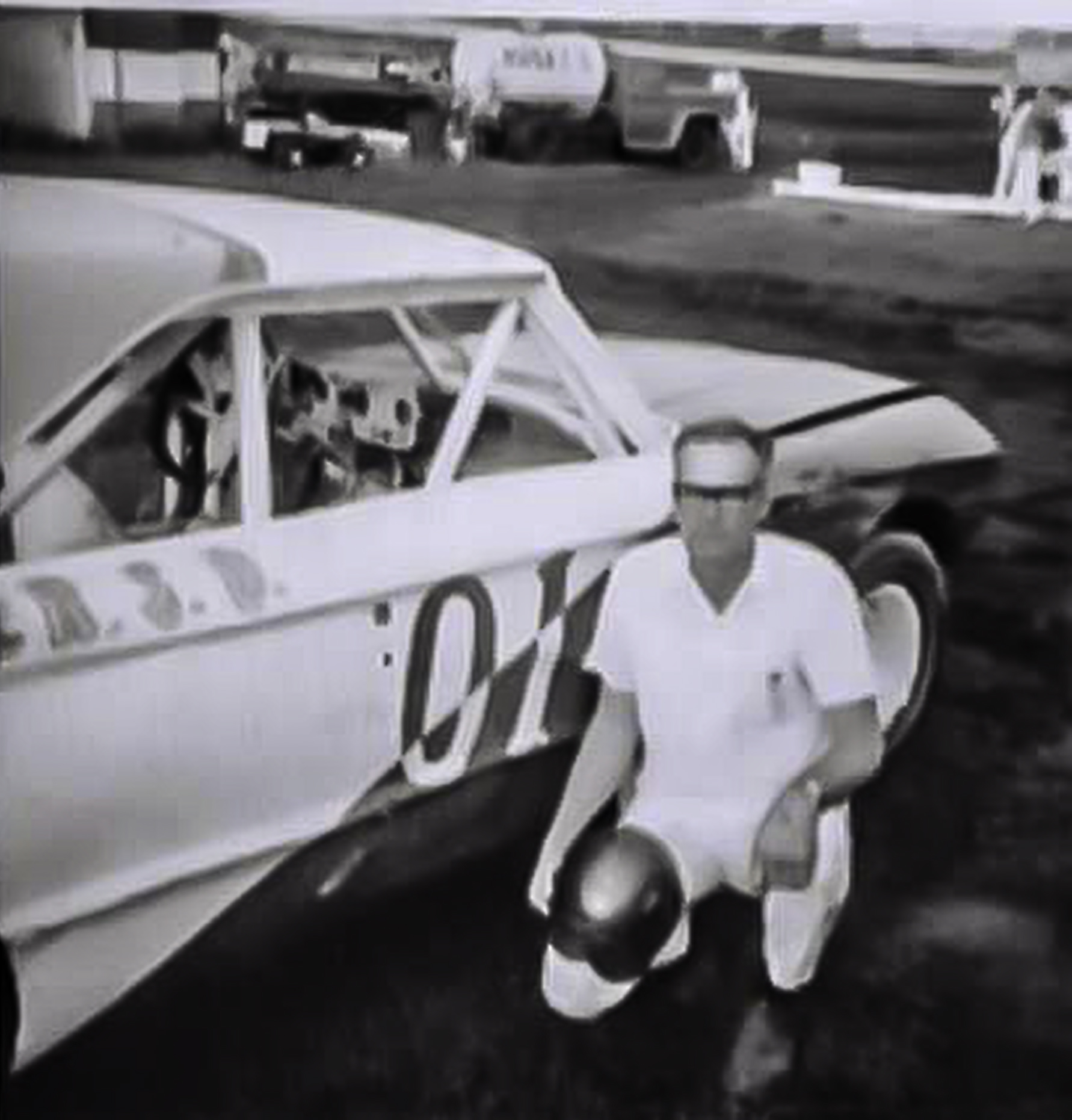 Open - 1971 - Paul Stogsdill of Wagner, SD, posing with his race car ...