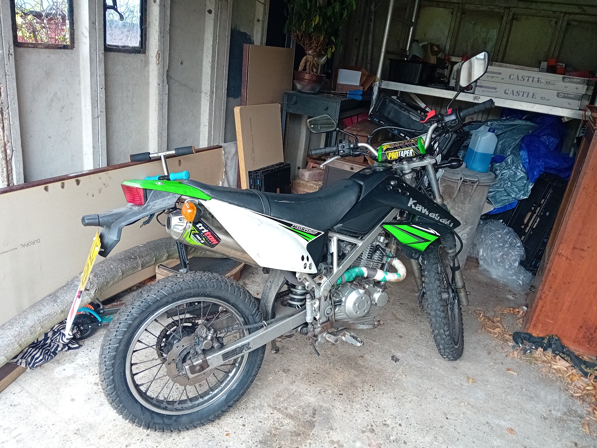What is the service cost for a Kawasaki KLX 230sm?
