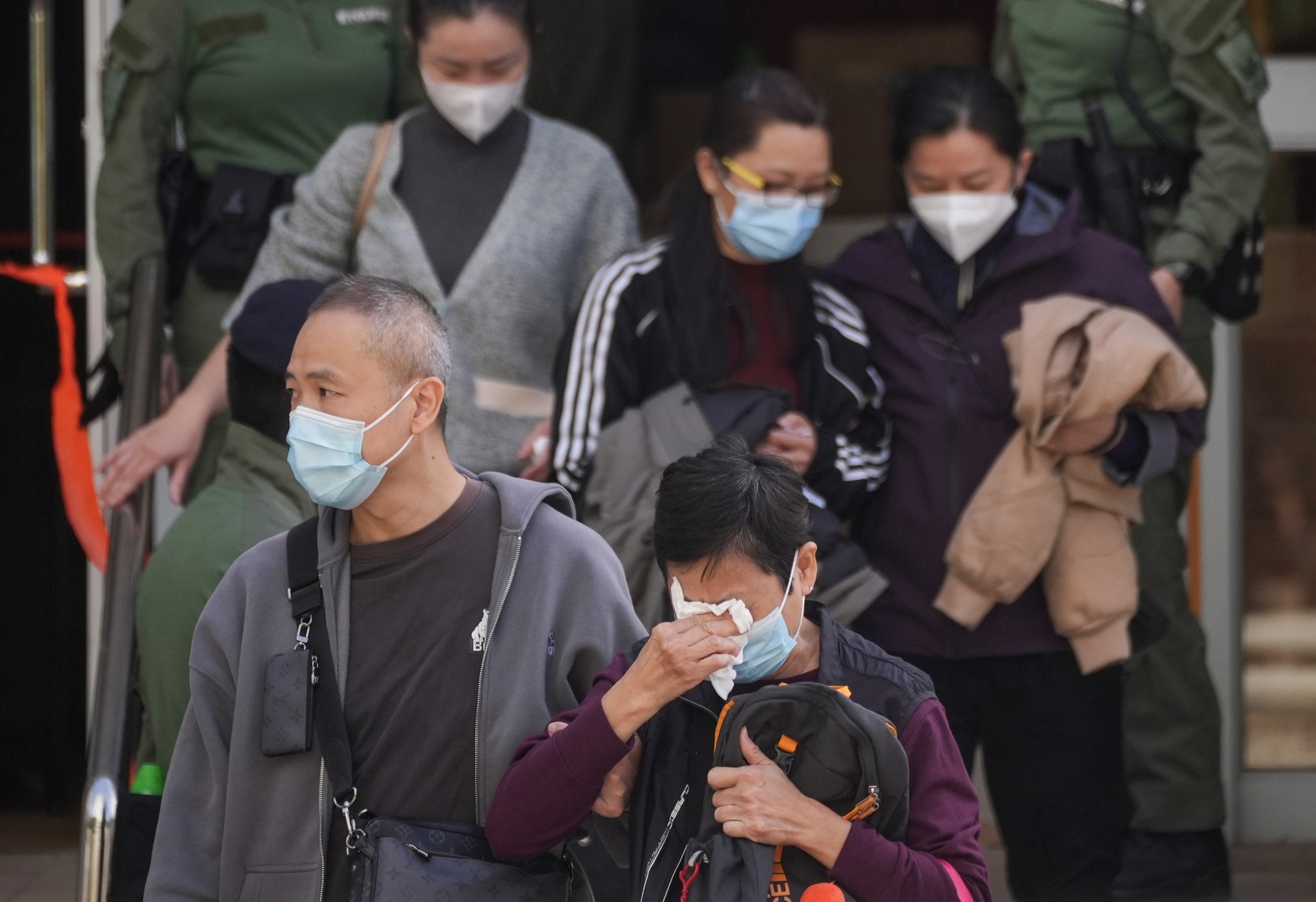 SCMP - People leave Tai Po’s Kwong Fuk Community Hall after identifying ...