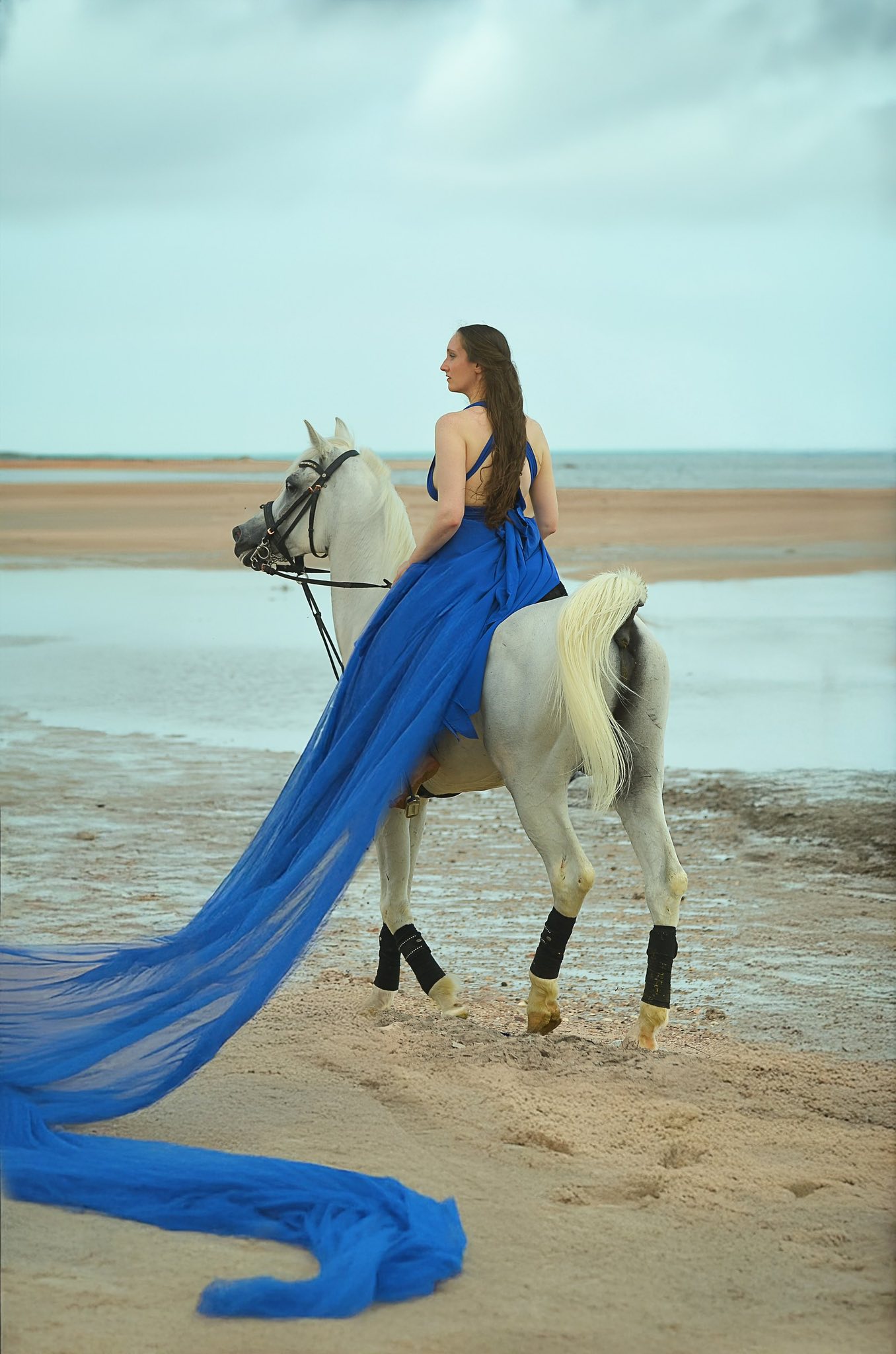 blue dress beach photoshoot Lady in flying by the sea Family