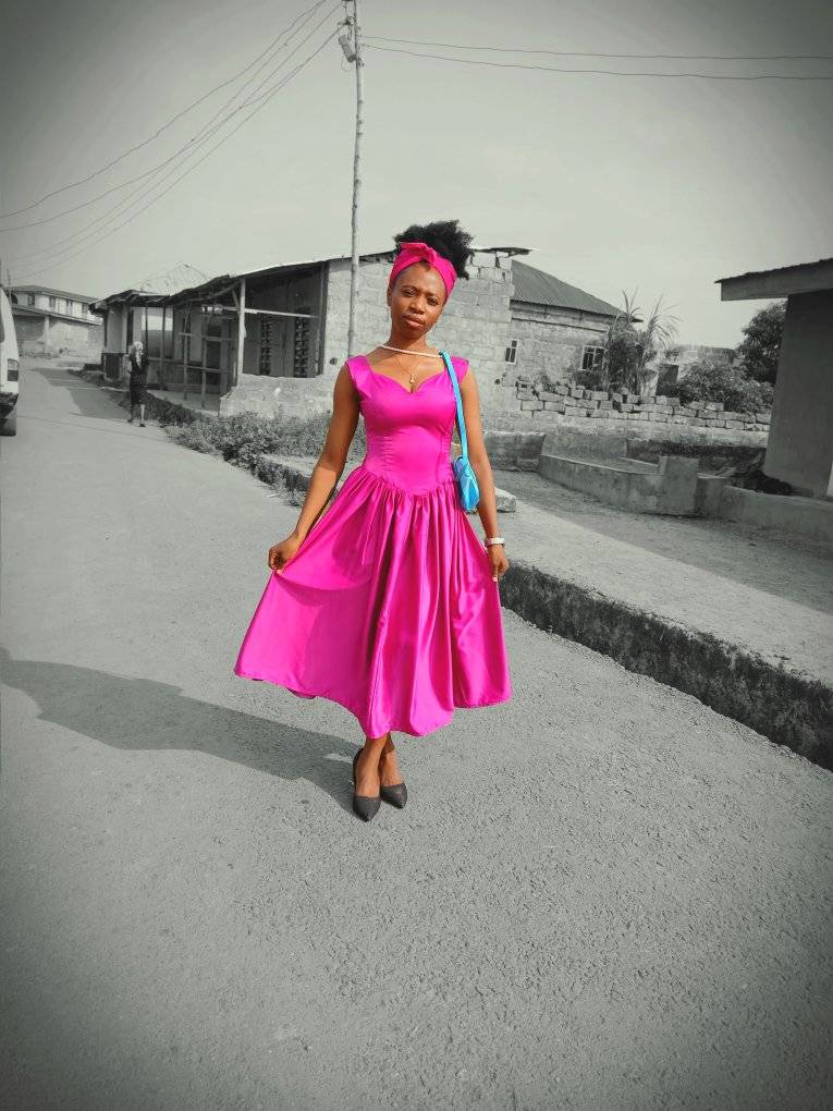 Esther Abiola rocks a pink dress with confidence