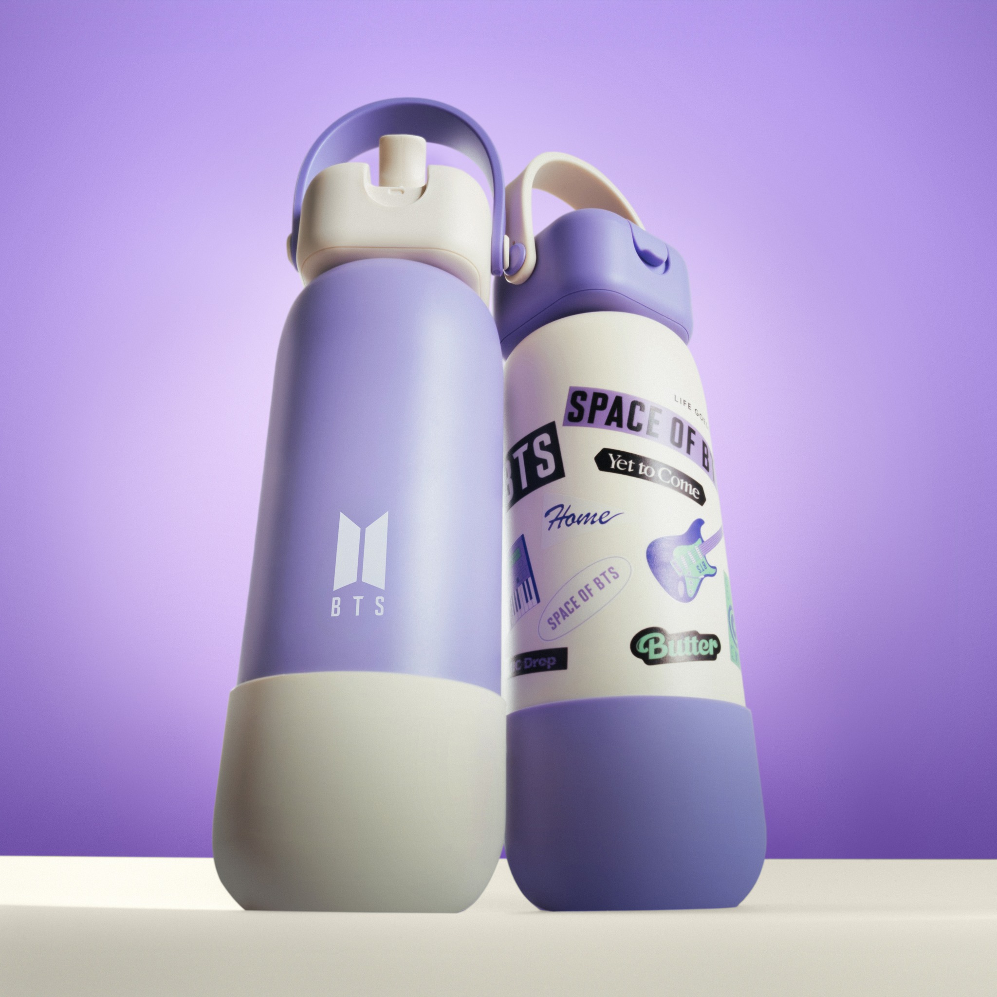 The limited-edition Space of BTS Robo Flasks in purple and white