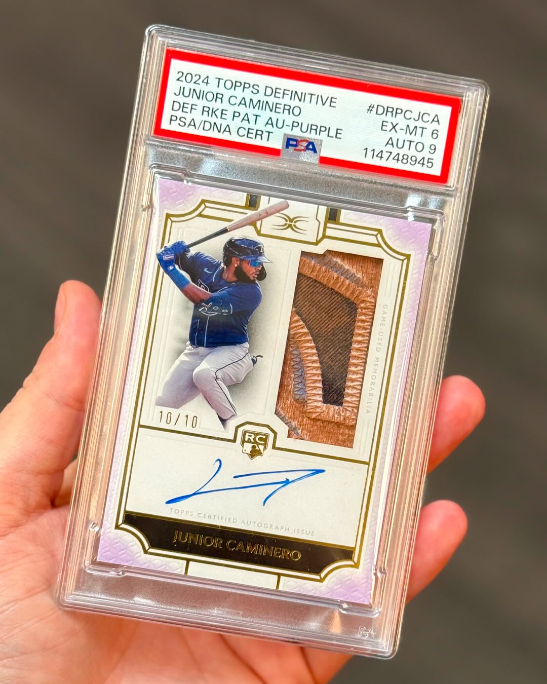 The game-used patch inside this Junior Caminero card is filthy
