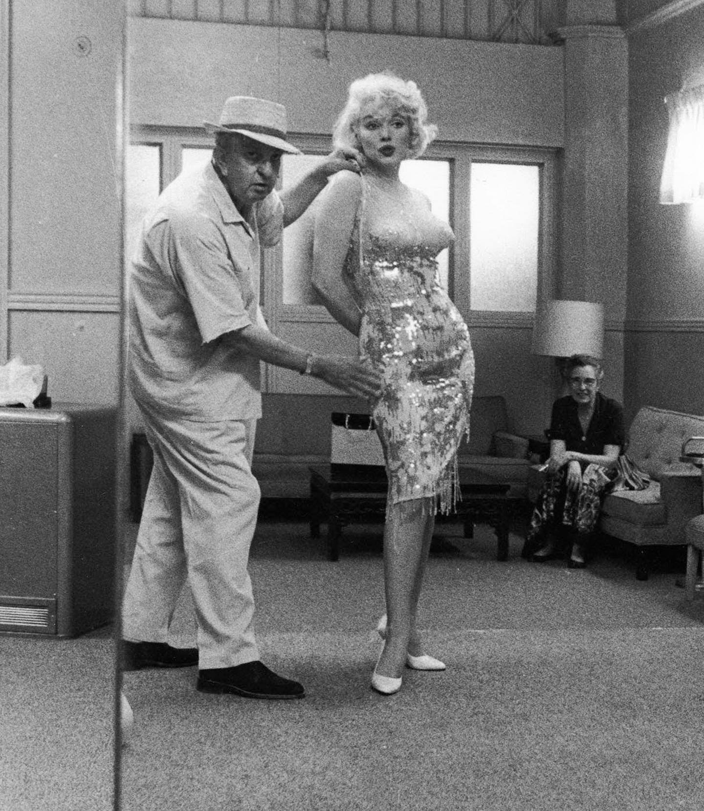 Marilyn Monroe during a wardrobe fitting for “Some Like It Hot” with costume designer Orry-Kelly, 1959. Orry-Kelly would win an Oscar for his designs