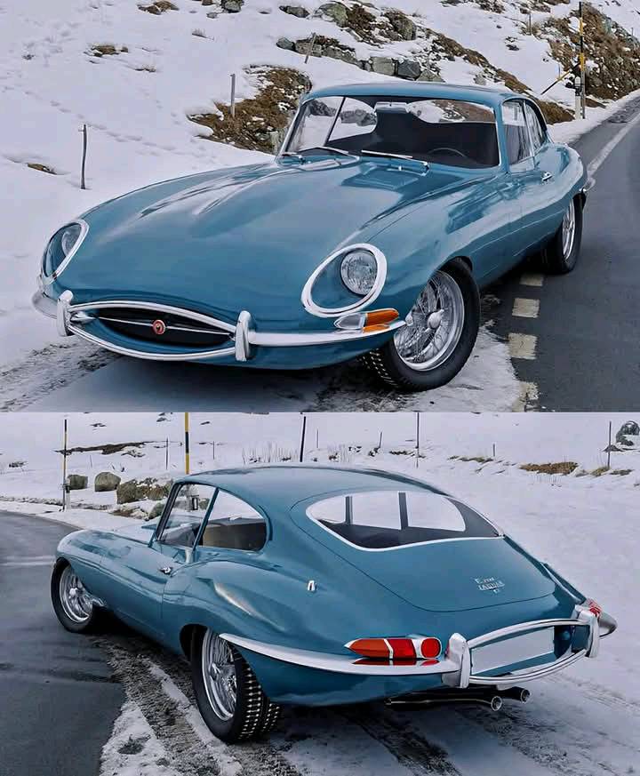 This Jaguar E-Type Coupe looks striking in dark blue, sleek