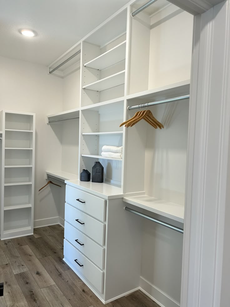 Home Interior Designs | A sleek and organized walk-in closet with ...