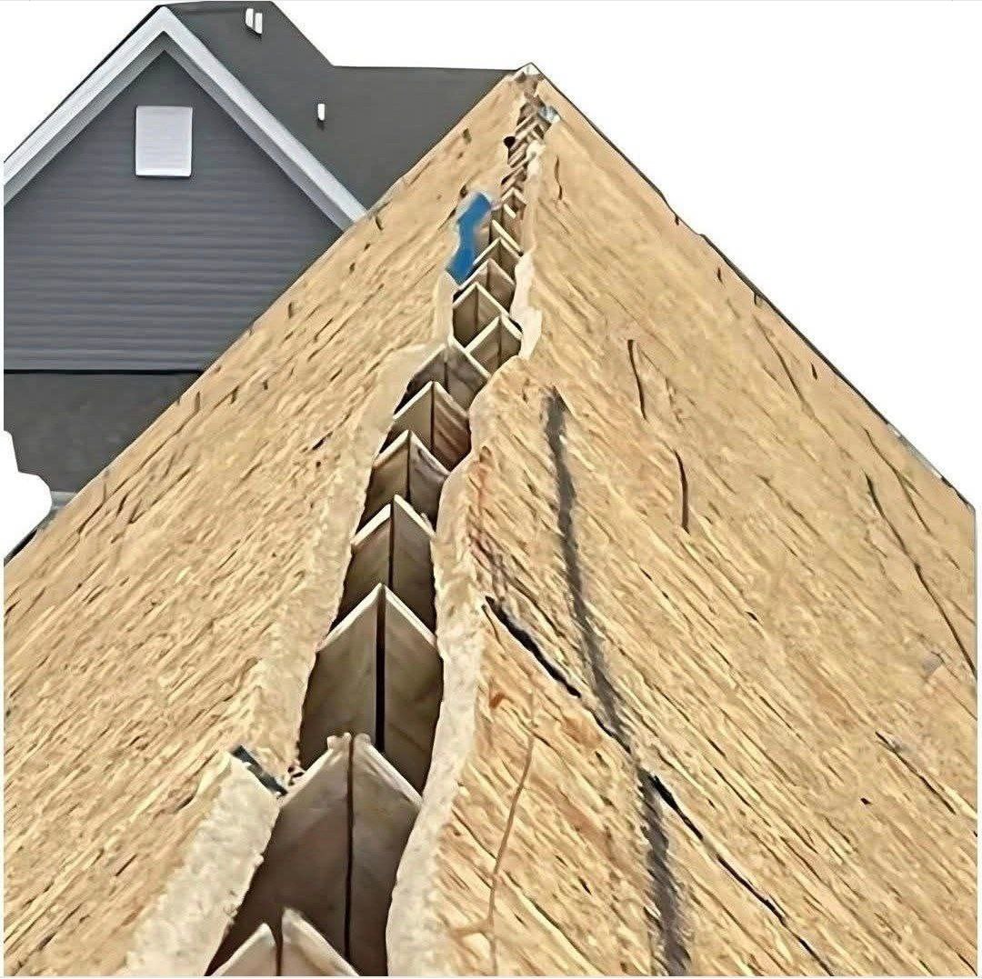 George - This image shows the construction of a roof ridge on a house ...