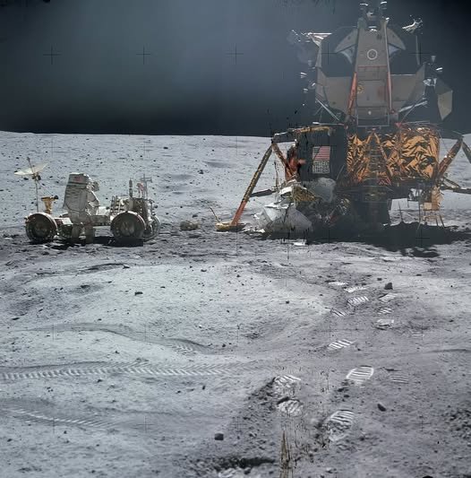 Space - John Young works at the Lunar Roving Vehicle (LRV) near the ...