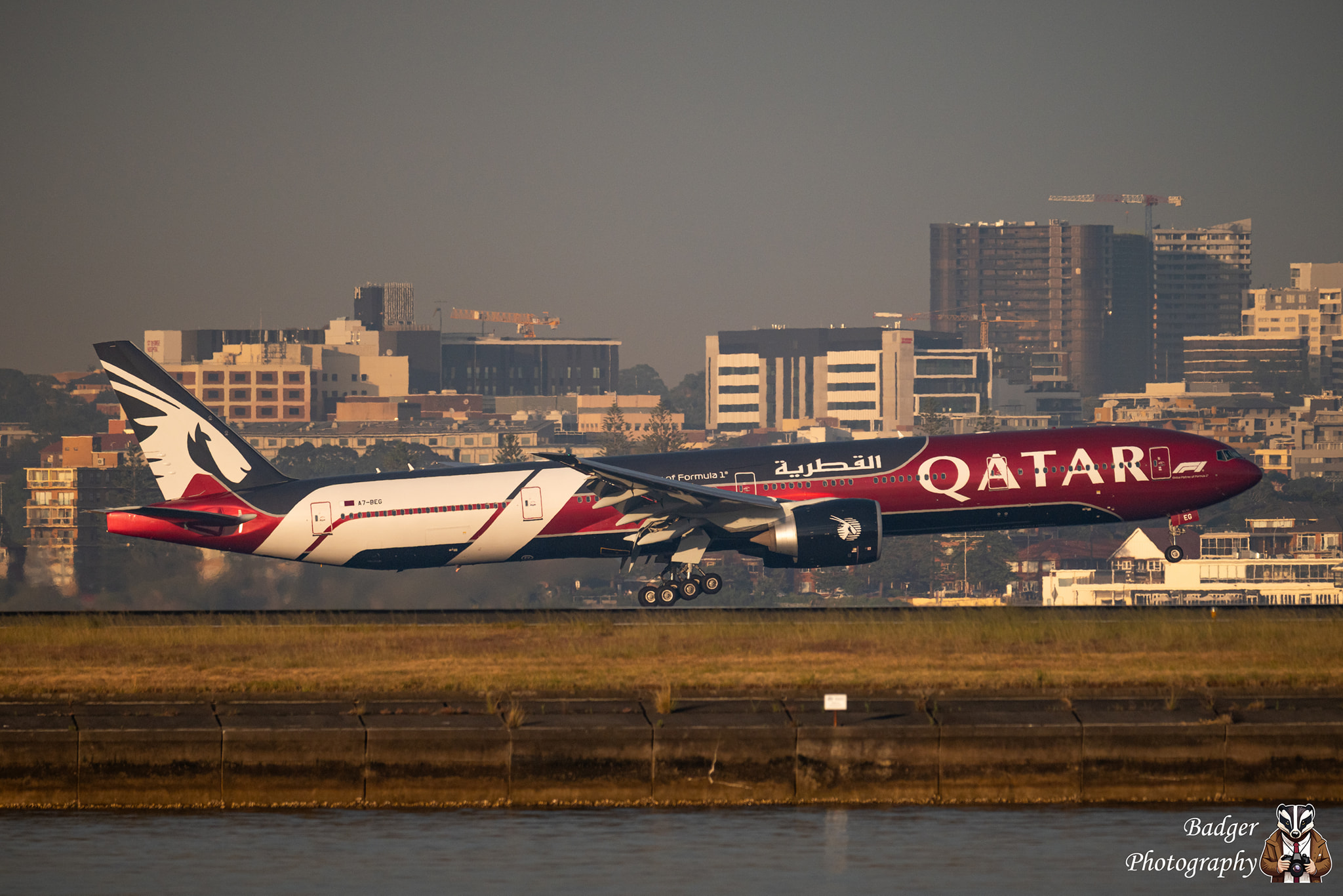 Qatar Airways Boeing 777-300ER with Formula 1 livery takes off