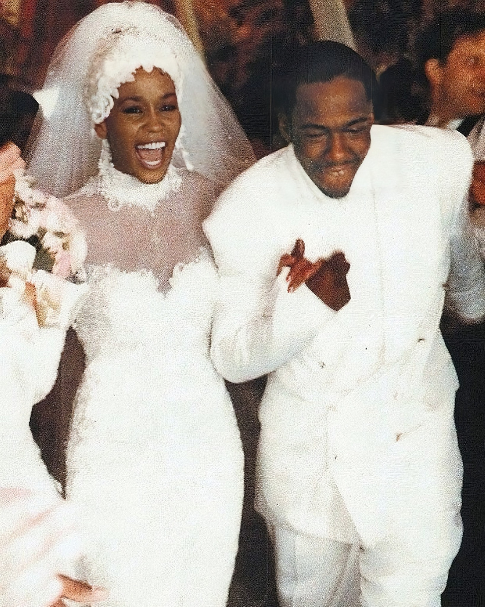 Whitney Houston was a stunning bride on July 18, 1992, when she married Bobby Brown at her estate in Mendham, New Jersey. Whitney wore an elegant white Marc Bouwer gown with a