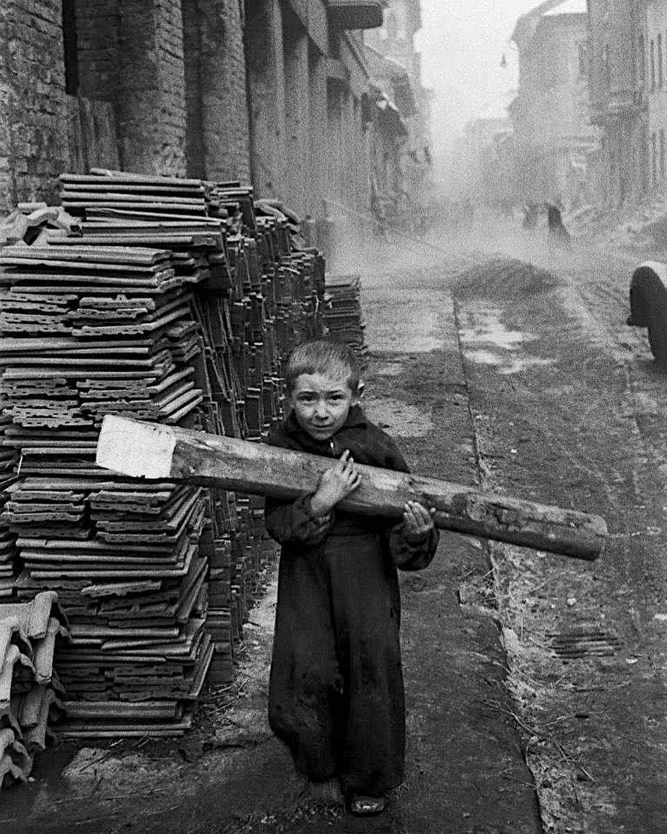 Erich Lessing's photograph of a boy carrying firewood in Budapest 1956