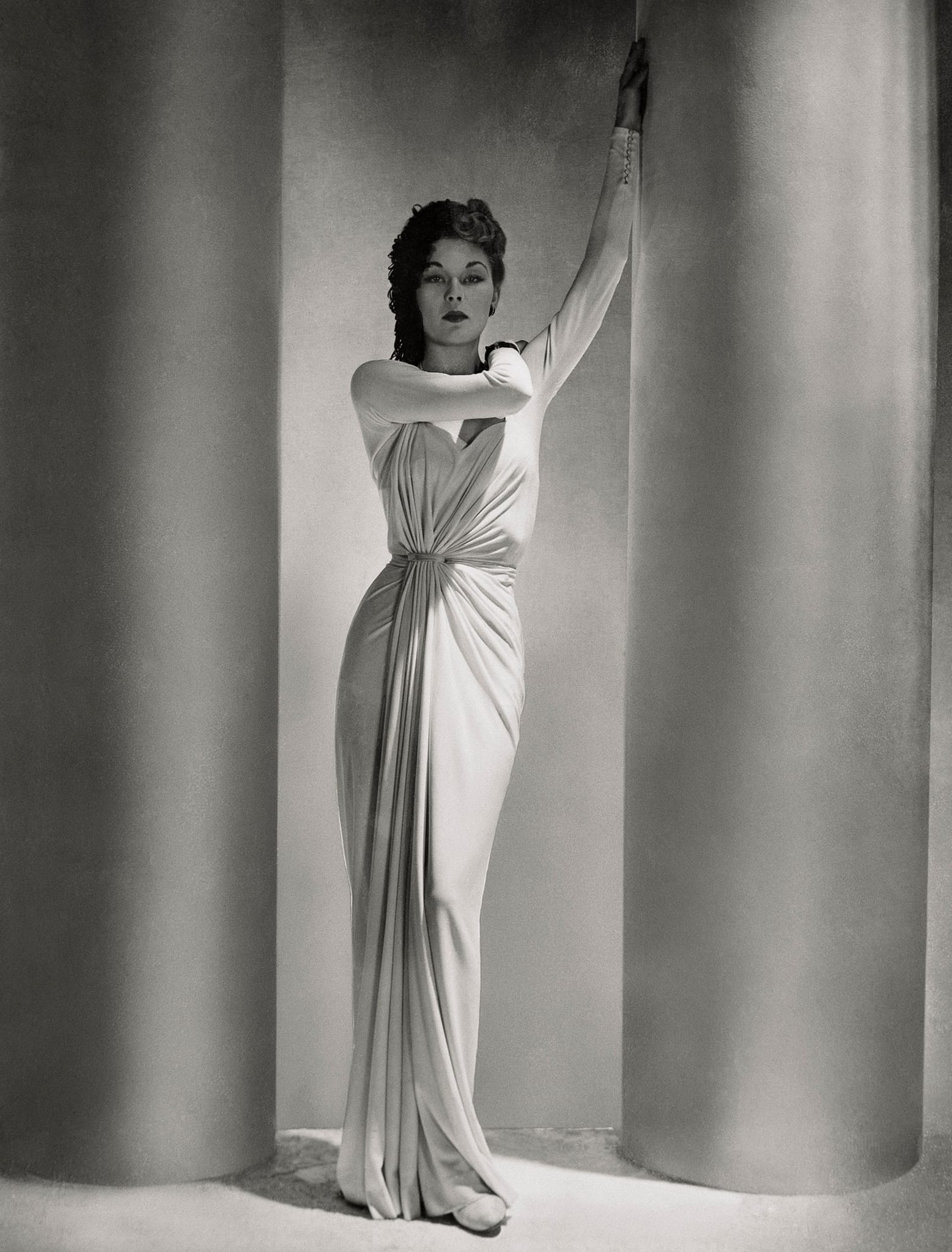 What are the details of the model's outfit in the 1938 Vogue magazine?