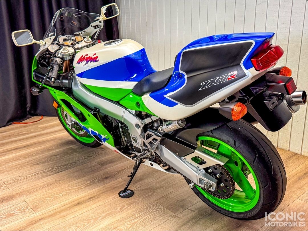 The 1993 Kawasaki Ninja ZX-7R is pure 90s aggression—heavy, stable