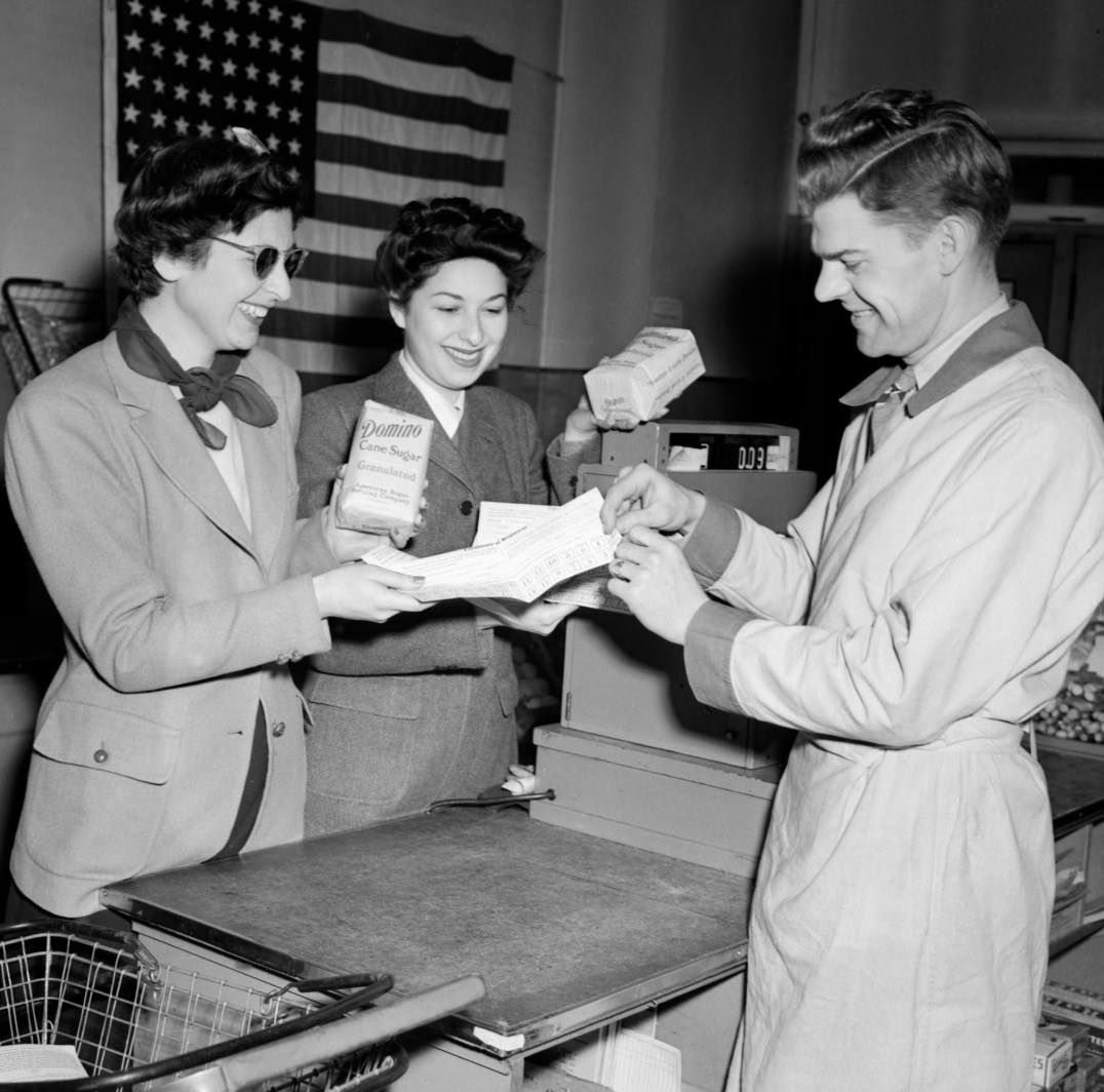 Two women present ration coupons to... - Historical Photos YT | Facebook