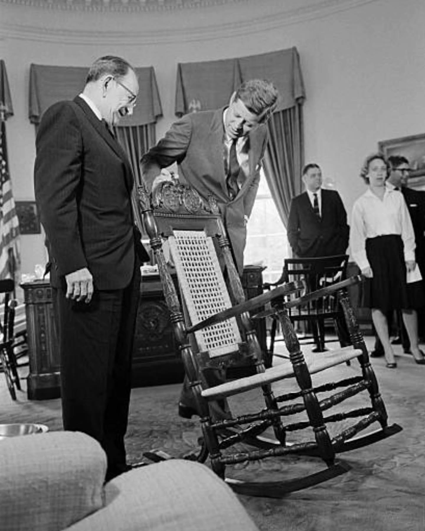 Sari - President John F. Kennedy inspects a carved mahogany rocking ...