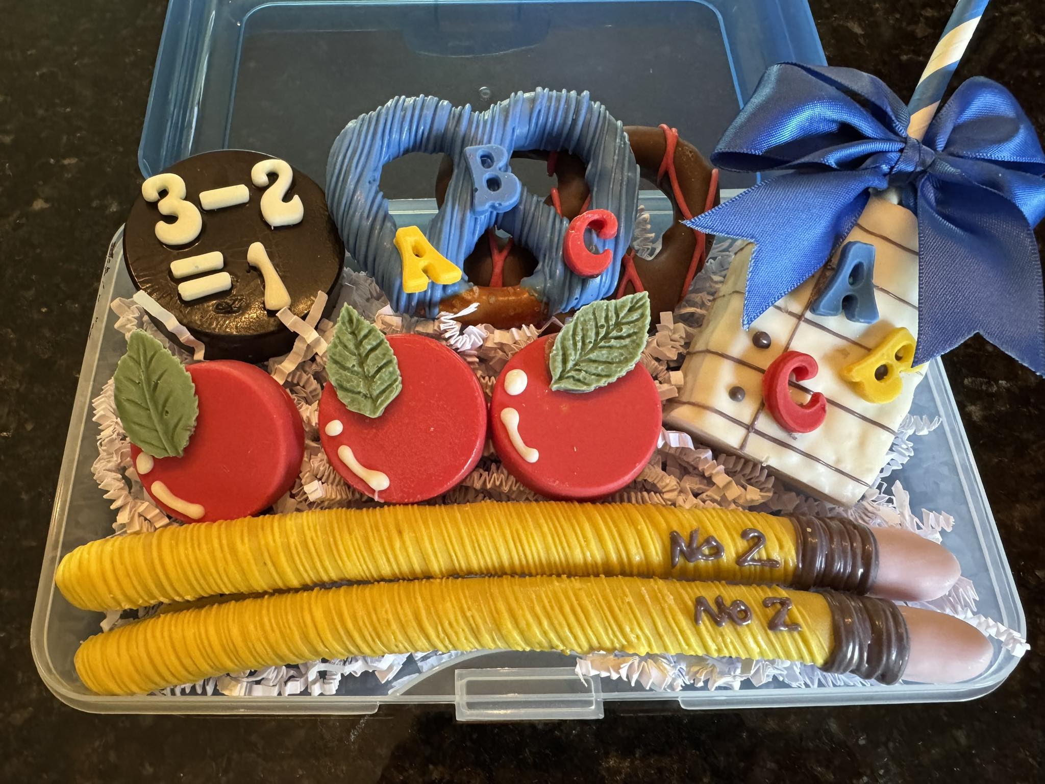 Teacher appreciation treat box with decorated pretzels and Oreos