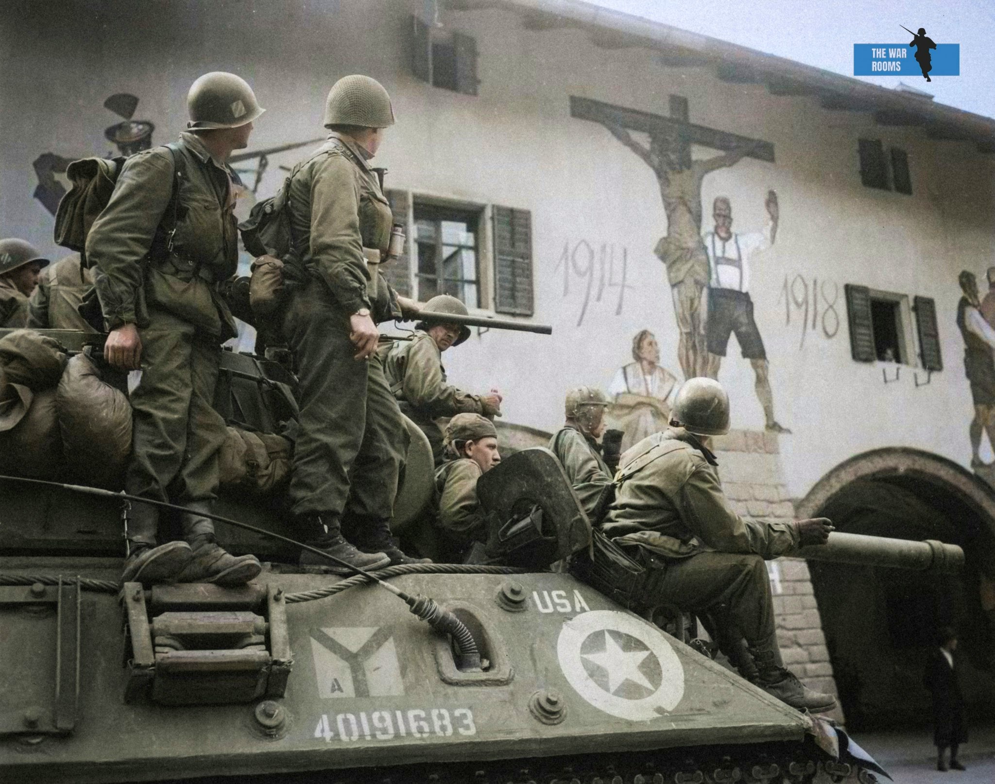 May 4 1945 US troops looking at a large painting on the wall of a