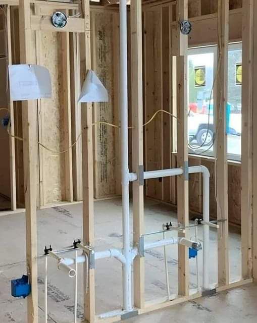 Plumbing - a rough-in plumbing and electrical setup in the framing ...