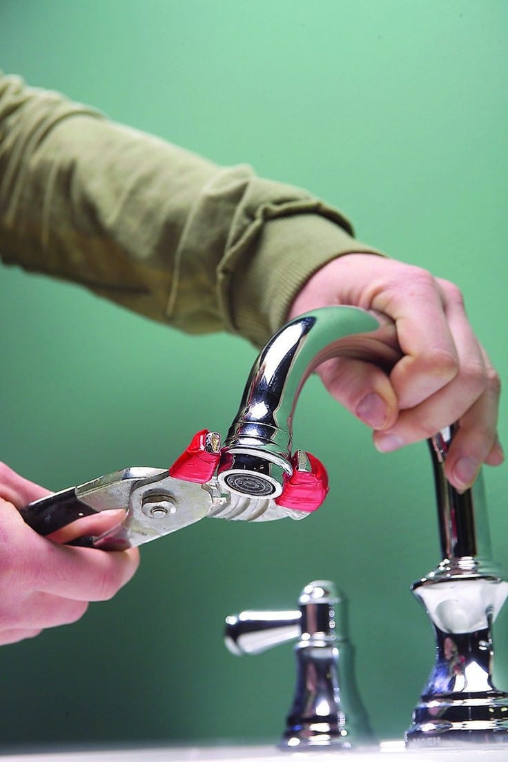 Plumbing - The process of removing an aerator from a faucet spout using ...