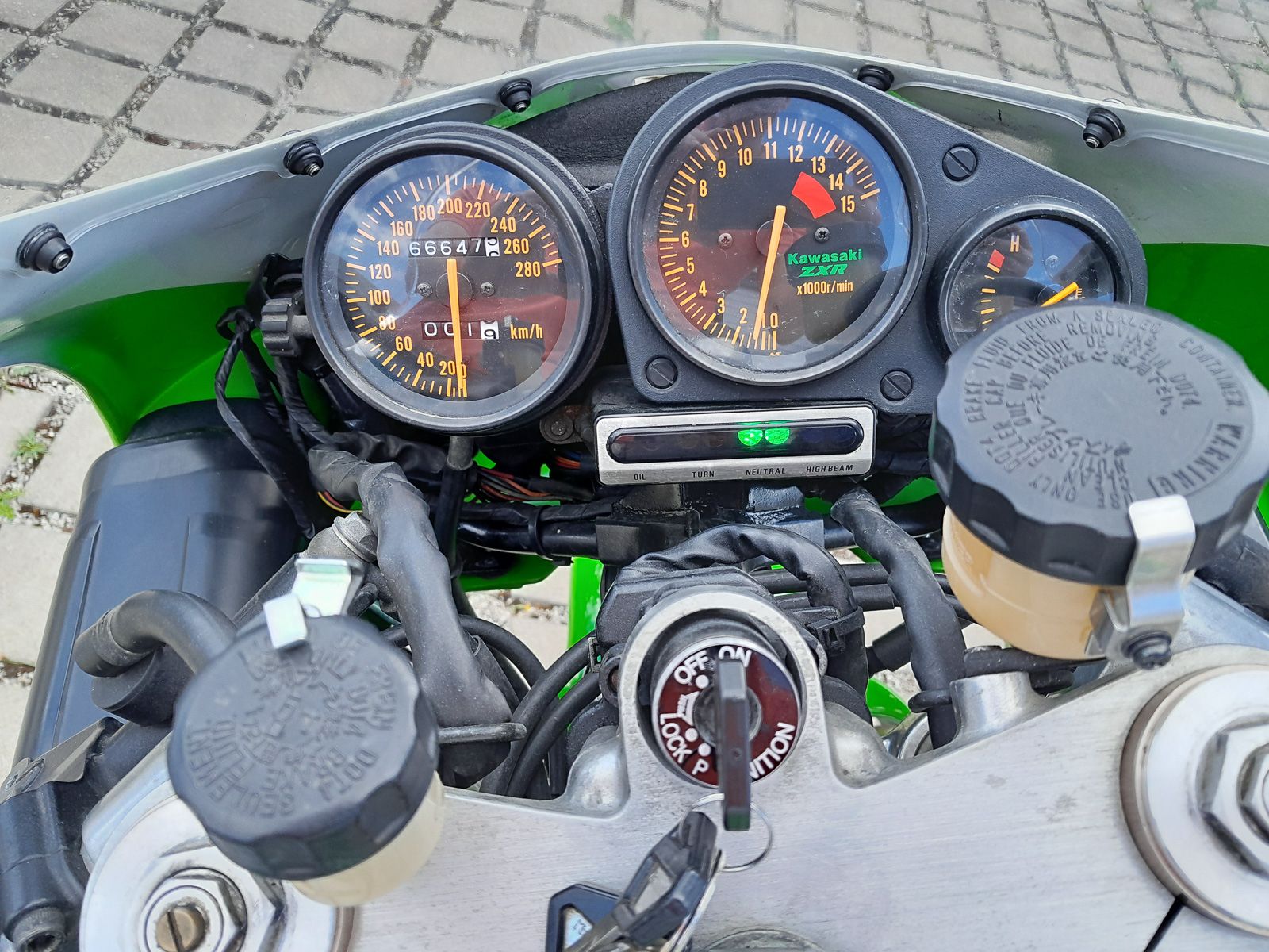 Kawasaki ZXR750R homologation cockpit with analog speedometer and