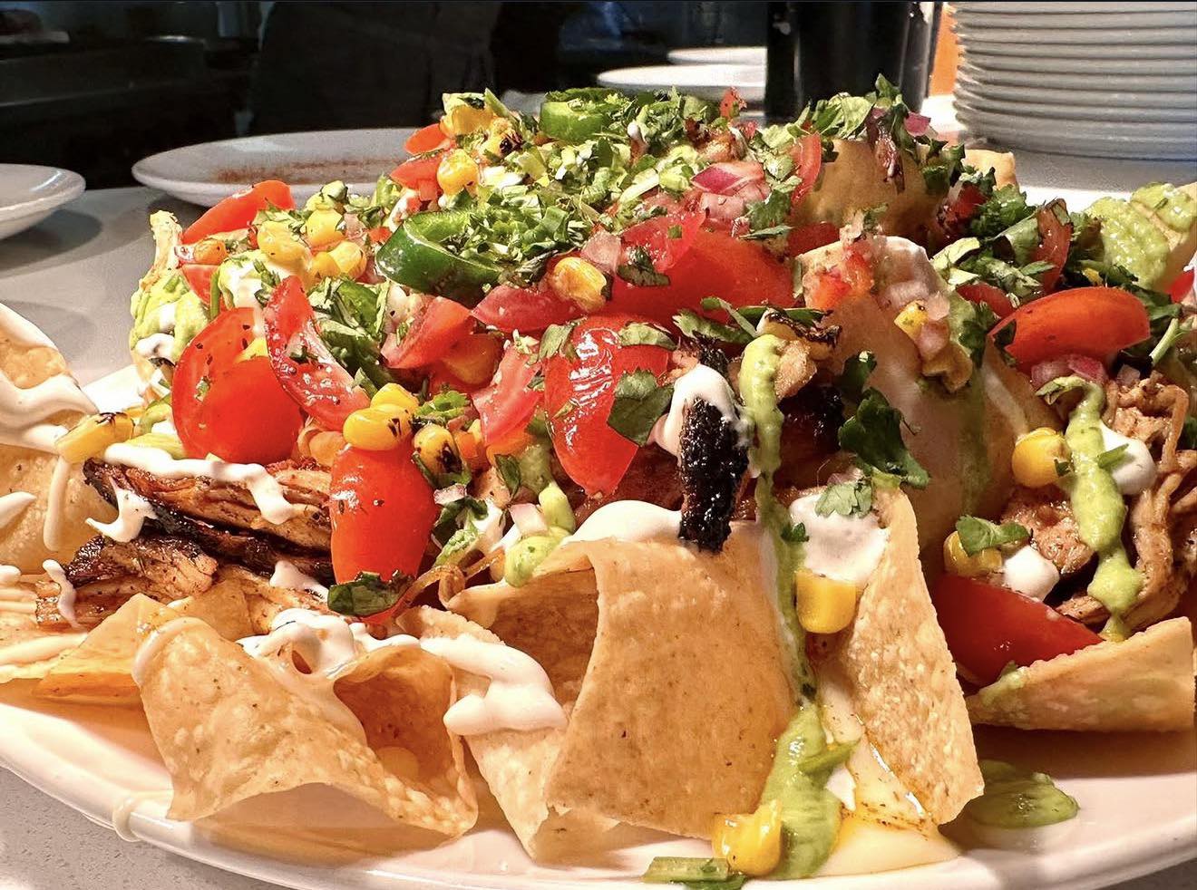 Plus Saporis smoked chicken nachos open September 6th in Quad City