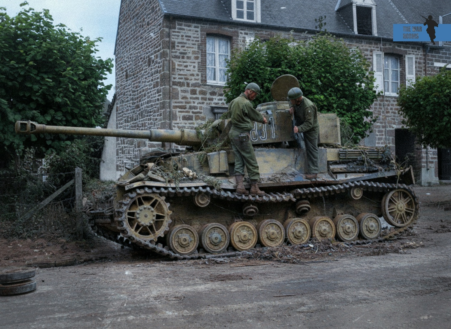 The War - A German Panzer IV is lying disabled on a street in Saint ...