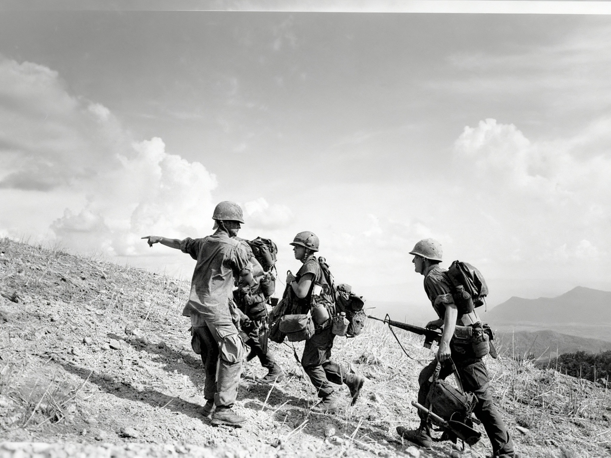 Old - A U.S. Marine sergeant points directions to a group of newly ...