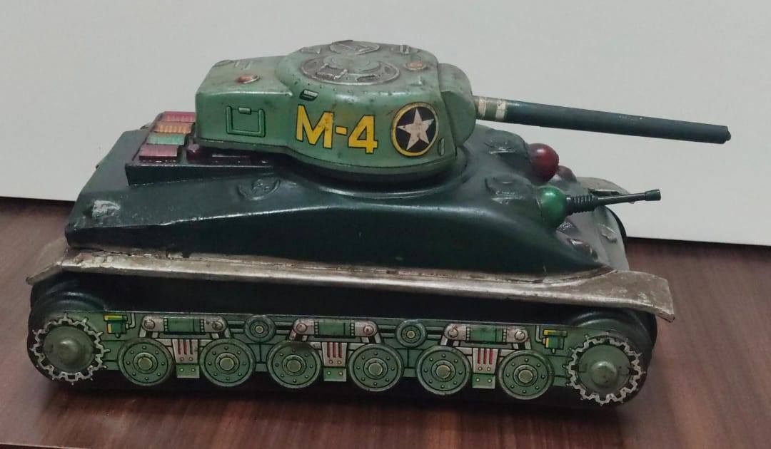 A vintage Taiyo MK4 Sherman tinplate tank, a collectible toy from