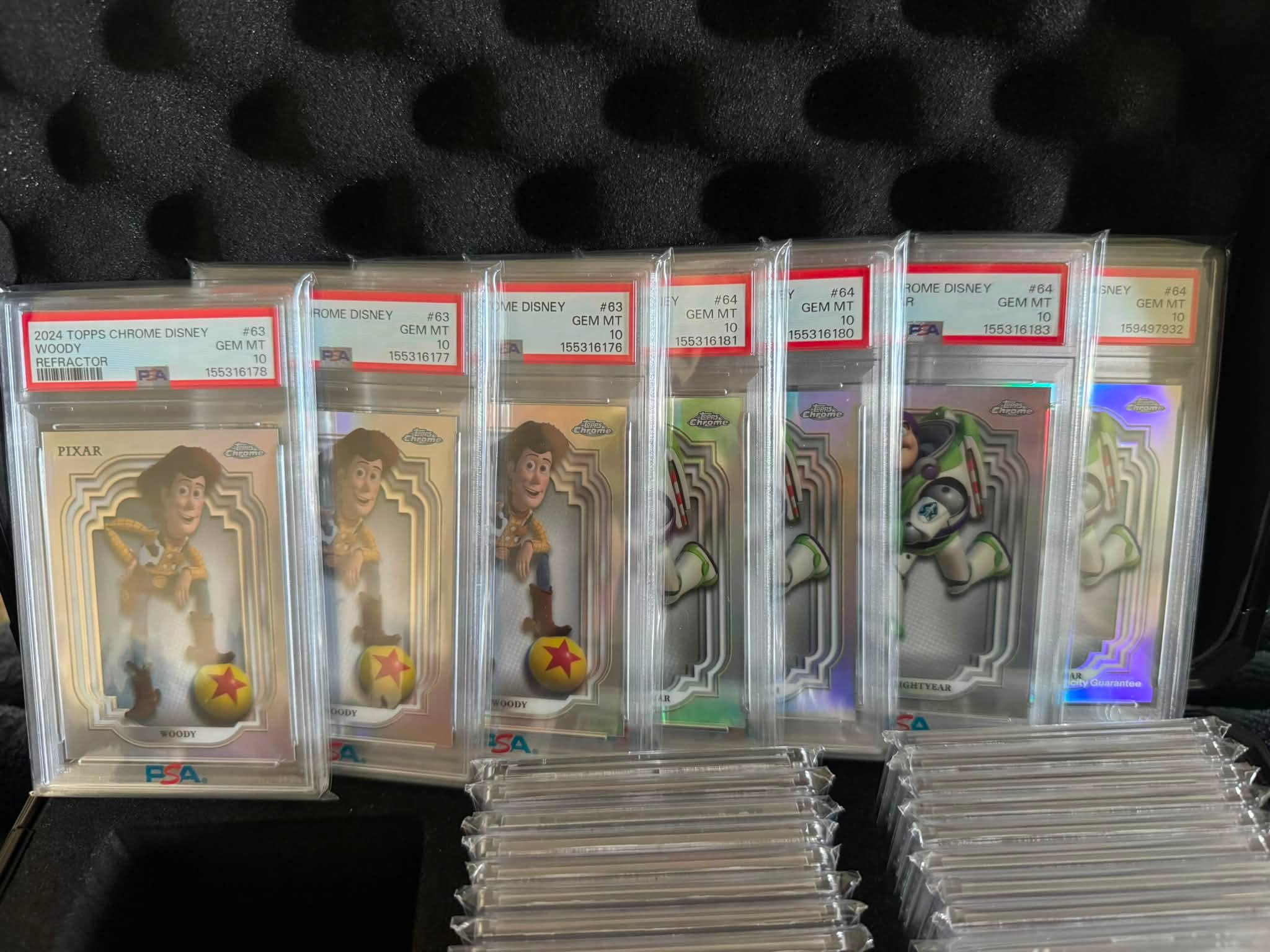 Disney lot!!! $7500 for refractors! 3x woody 10s, 4x buzz 10s