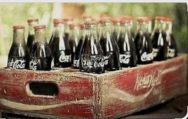 vintage six-pack of Coca-Cola in 500 ml glass bottles, within its