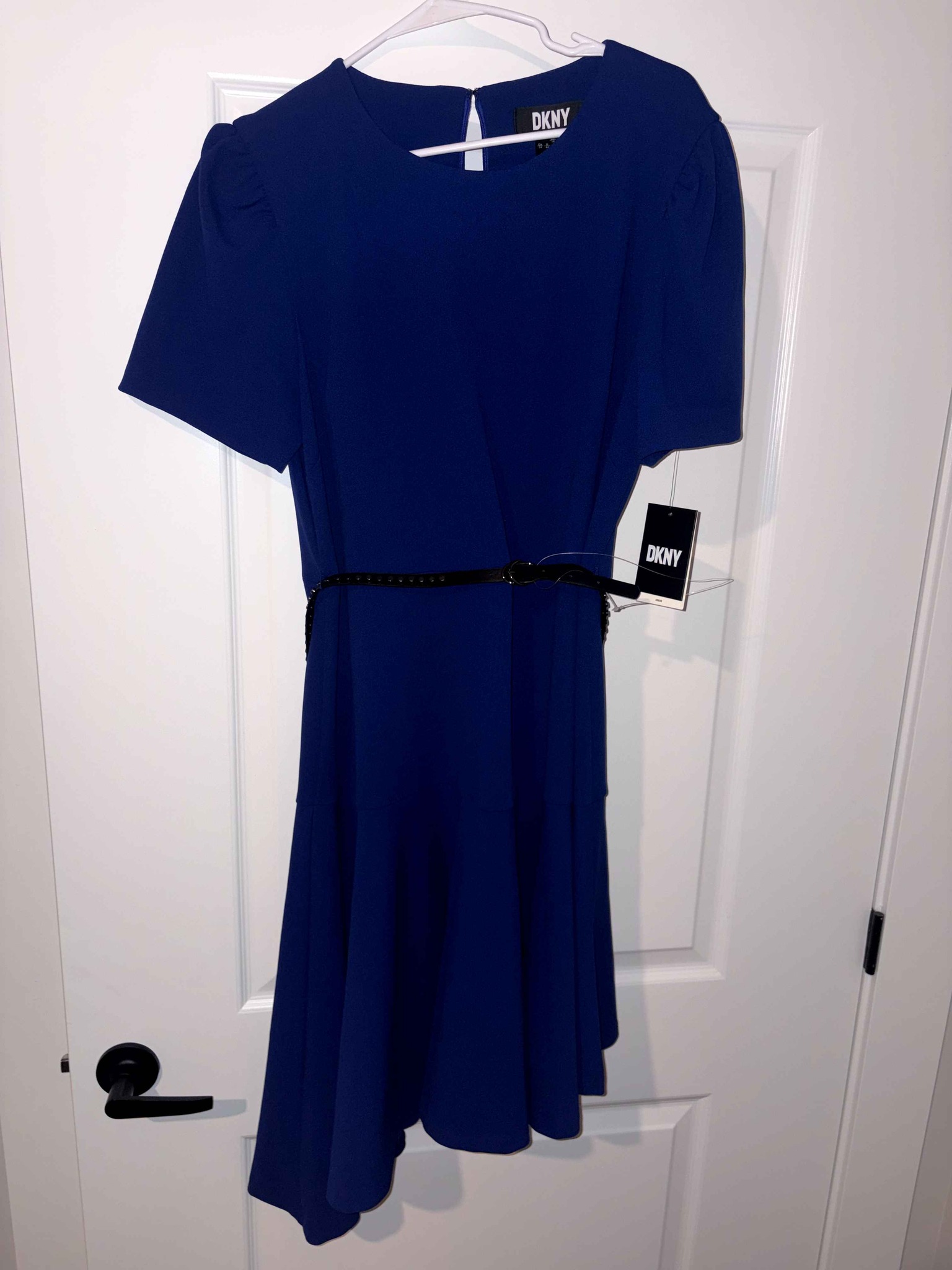 Brand new women's DKNY Royal blue dress. Comes with a black belt and has a back zipper. This is a beautiful dress! OBO