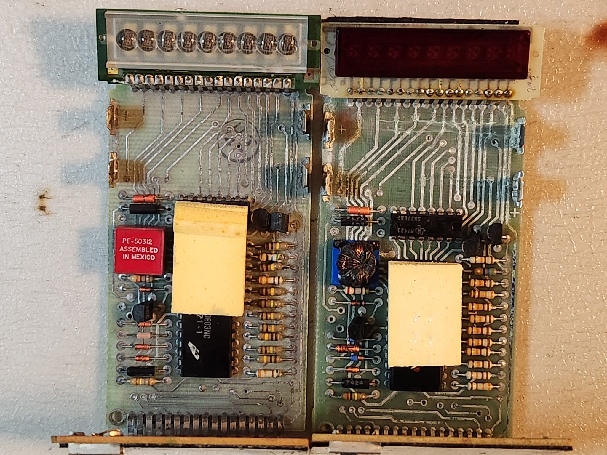 TI-1500 calculator circuit board comparison from 1975