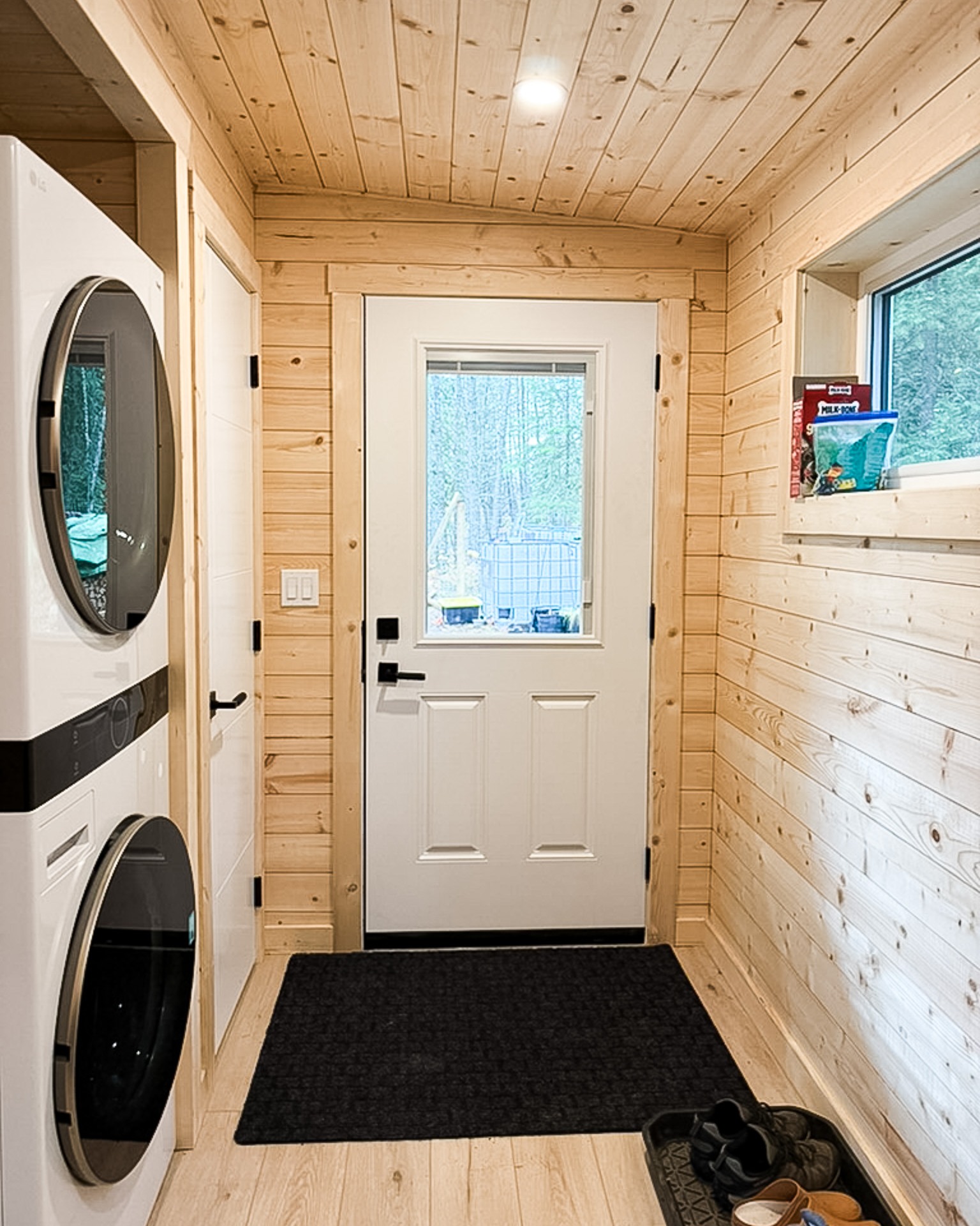 Elk - Inside the mudroom, everything has its place. Stacked washer and ...