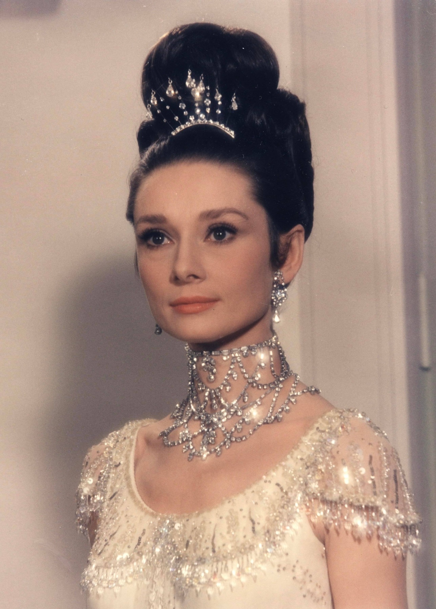 audrey hepburn in my fair lady dress wears a stunning ball gown embroidered with sparkling crystals and beads, created by Cecil Beaton for the 1964 film Lady. Her fashion accessories include matching jeweled shoes and Toddler Girls
