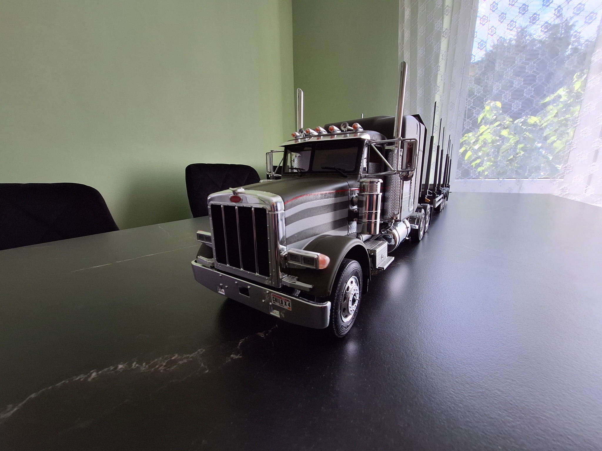From Mark H : Peterbilt 378 (No. 3857) & Timber trailer (No. 3868 