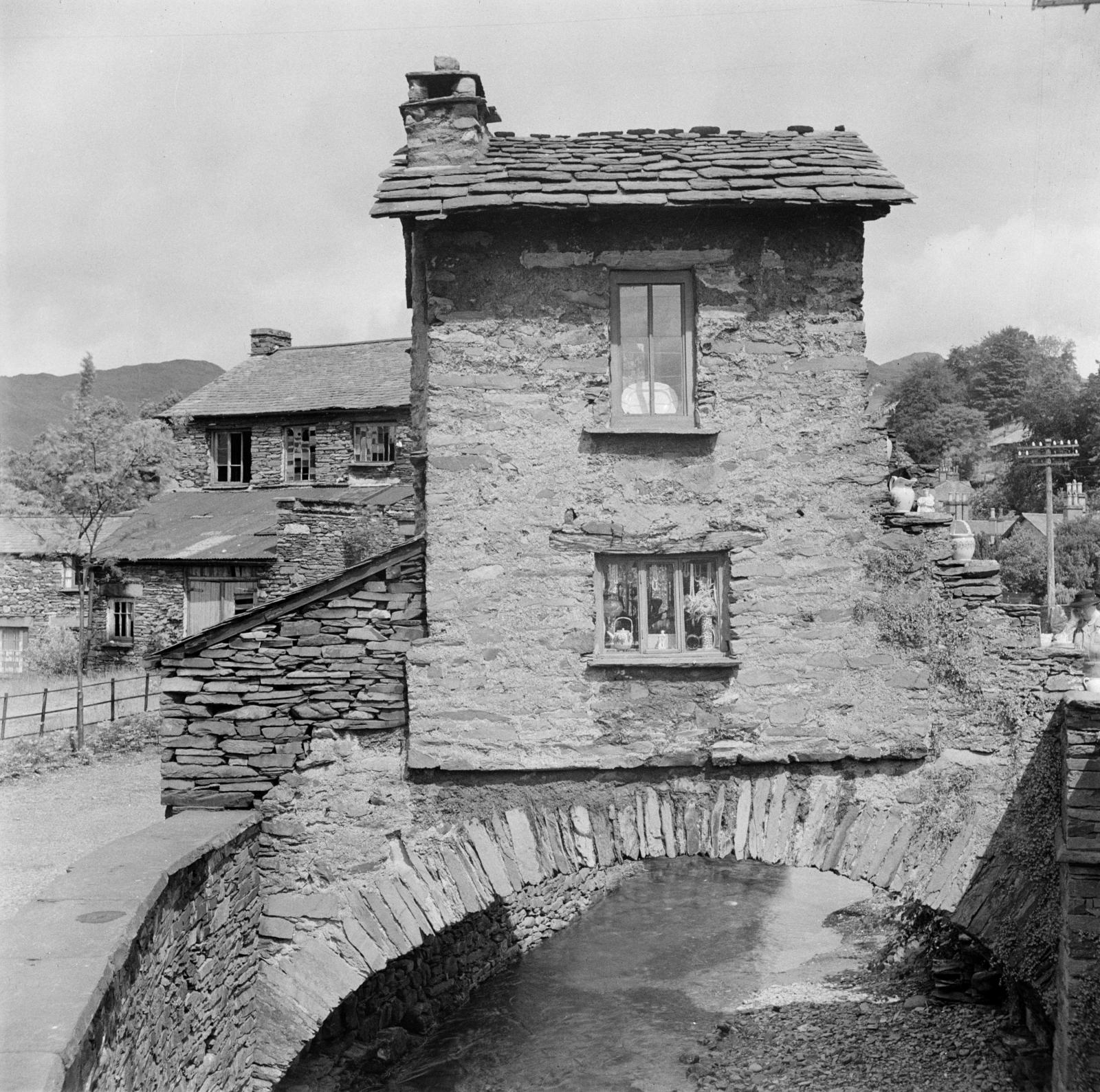 Which version of Ambleside's Bridge House do you prefer, then or now?