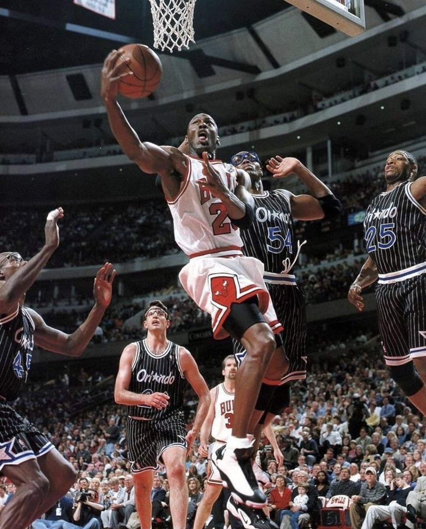 The NBA - 1998: Michael Jordan scores on a reverse layup against the ...