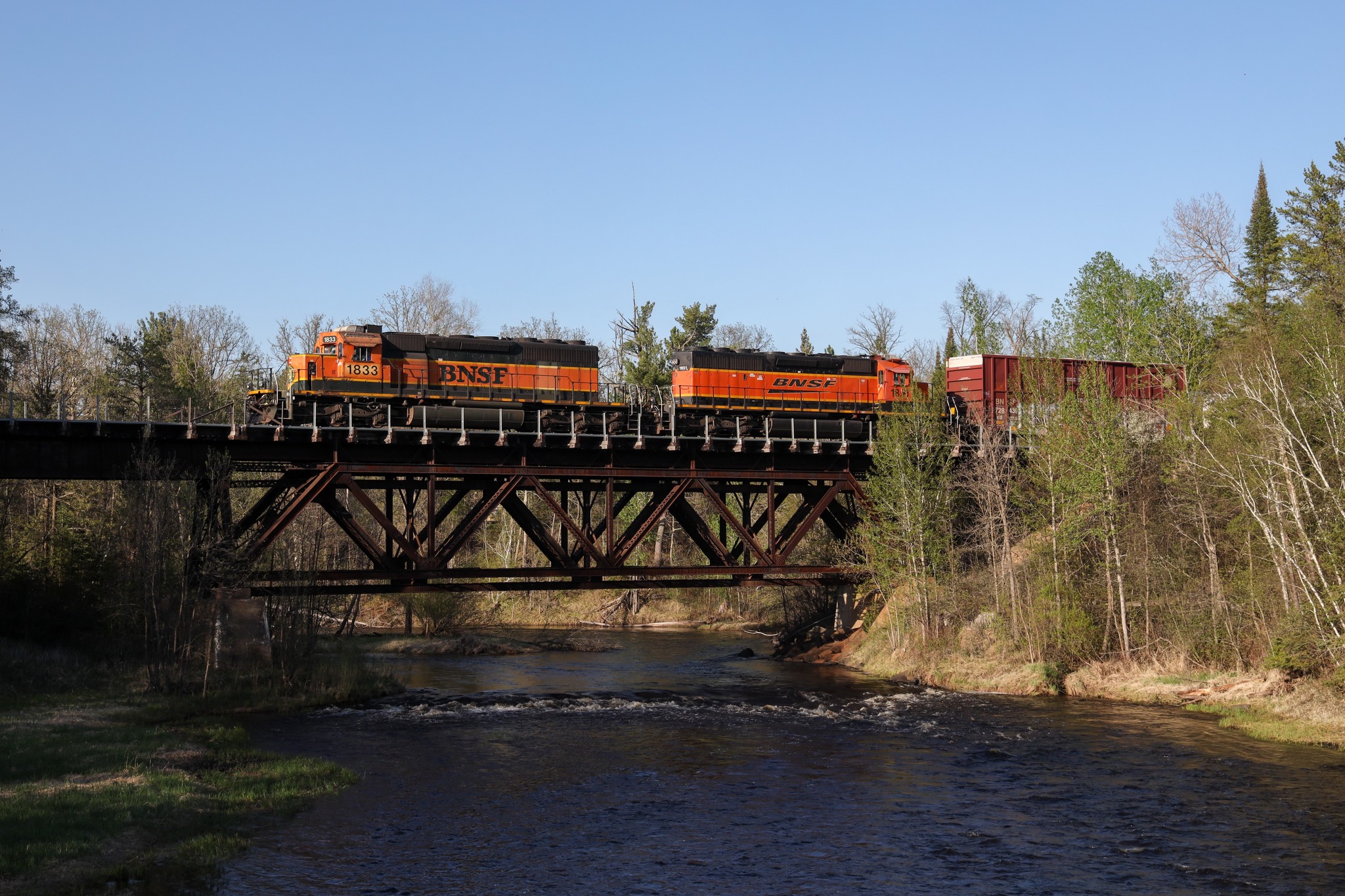 BNSF 1833 train with two orange SD40-2s in Cloquet