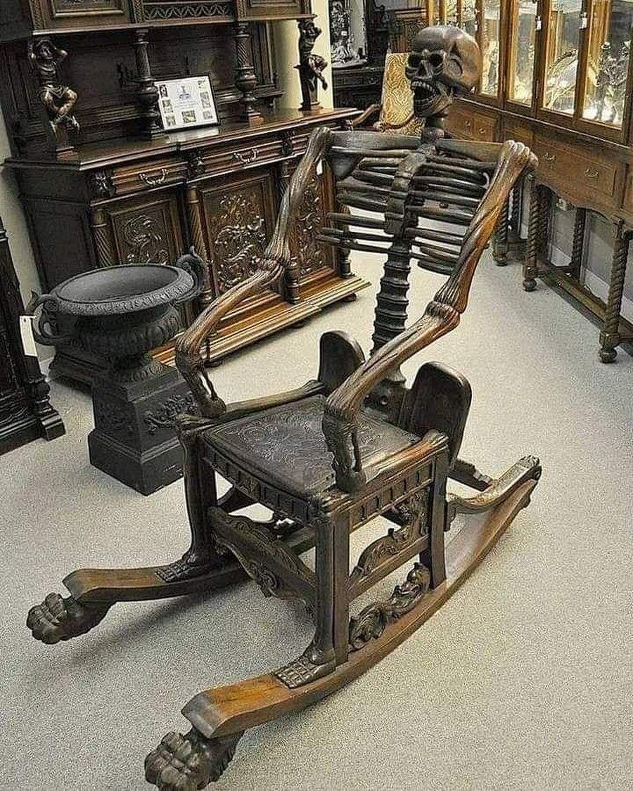 Black Wax Cafe - A Carved Skeleton Form Rocking Chair From... | Facebook