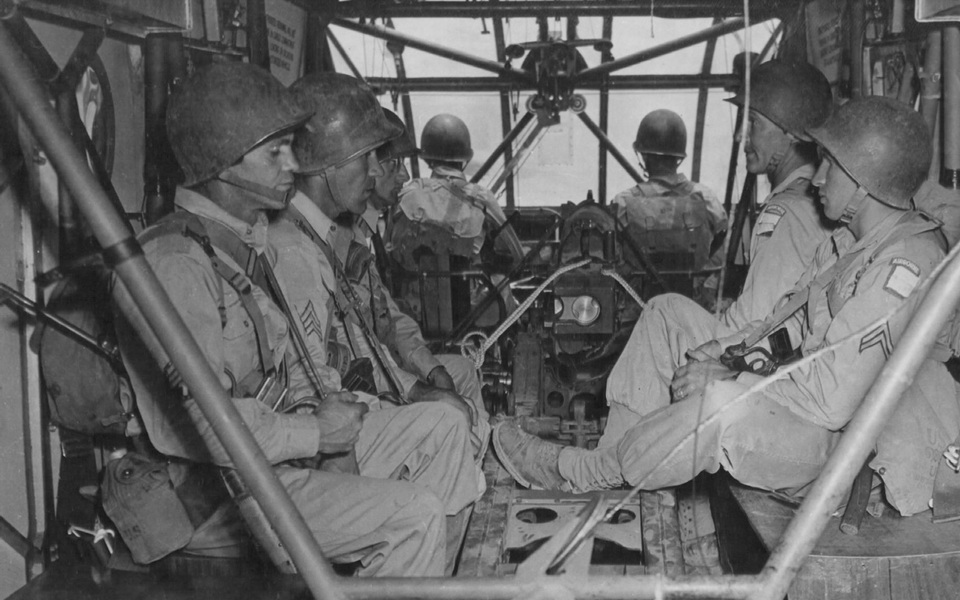 Inside a Waco CG-4A glider during WWII. These American soldiers