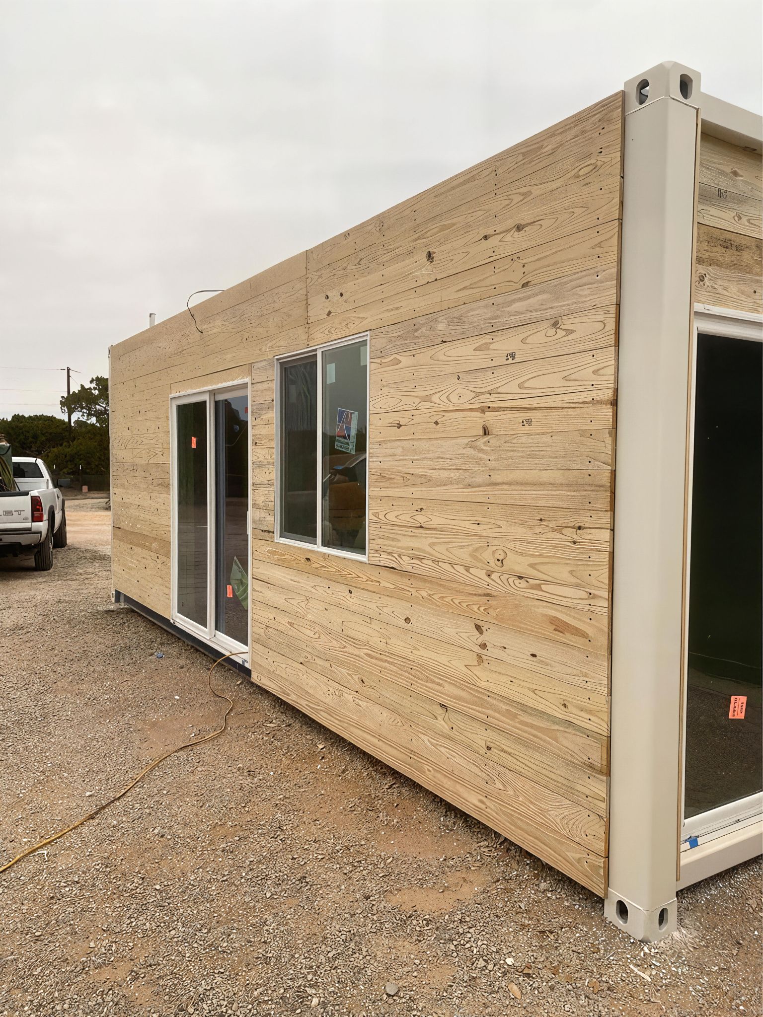 Living - From Steel to Style – A Shipping Container Wrapped in Wood ...
