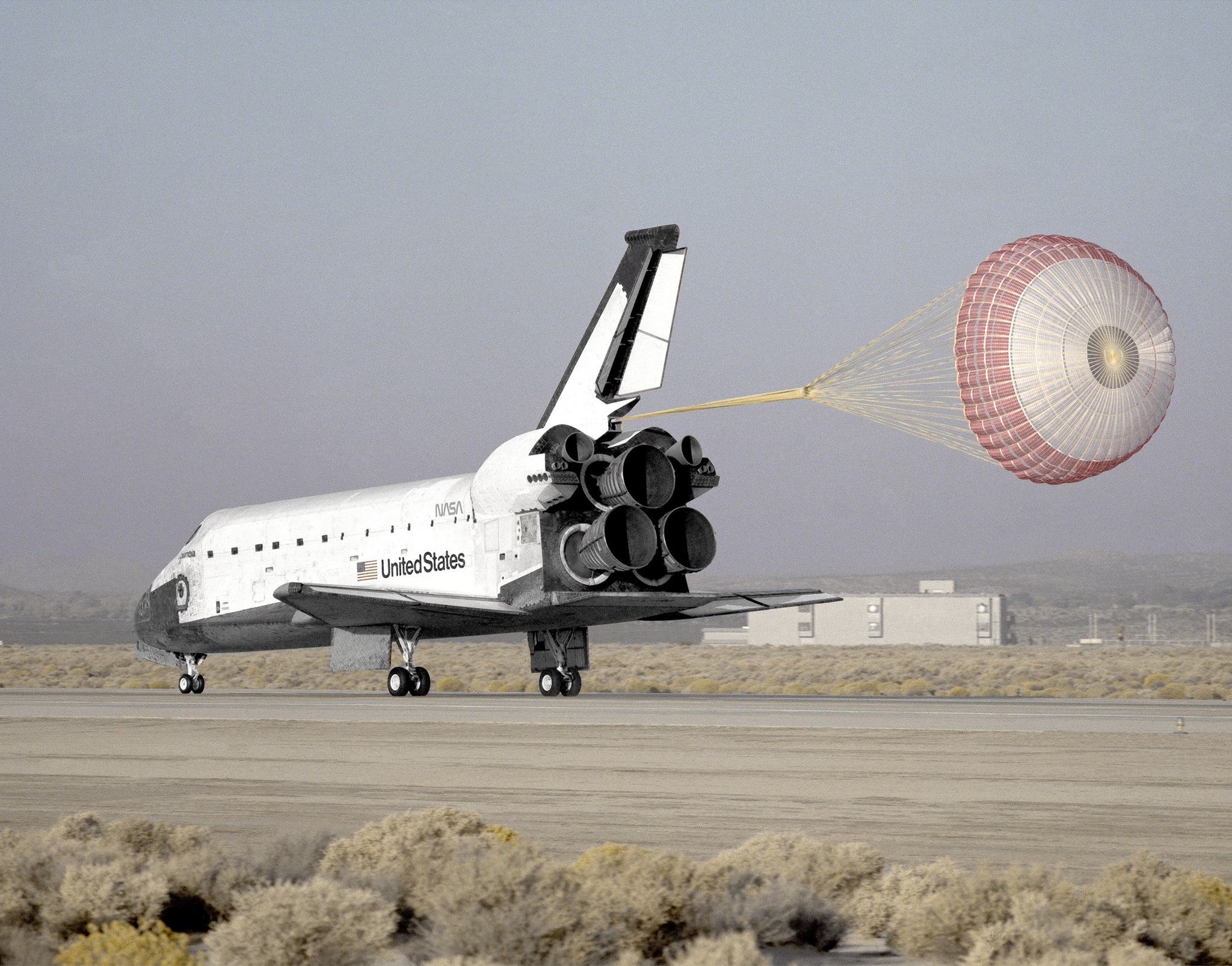 Blast - A drag chute slows the space shuttle Columbia as it rolls to a ...