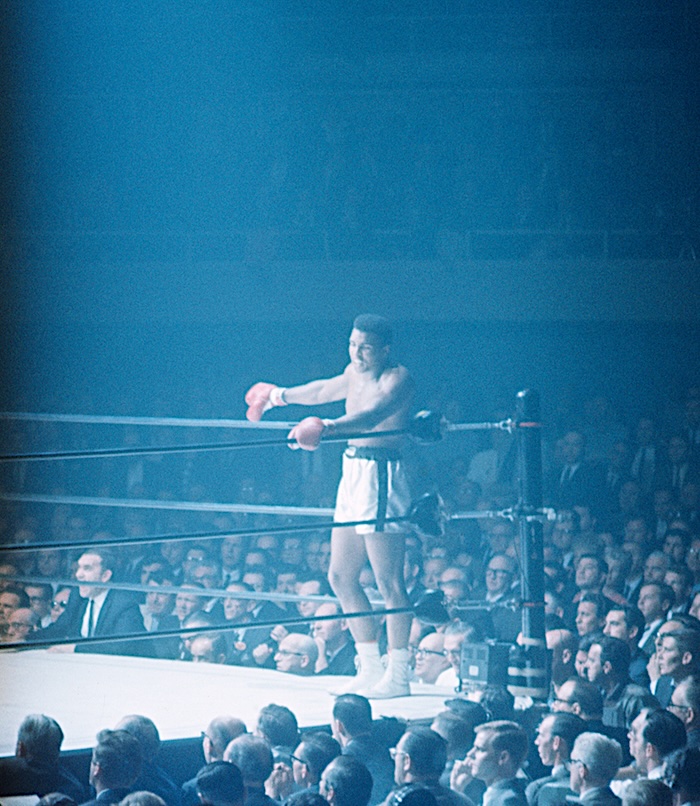 Boxing - Muhammad Ali talks to someone ringside as he waits in the ...