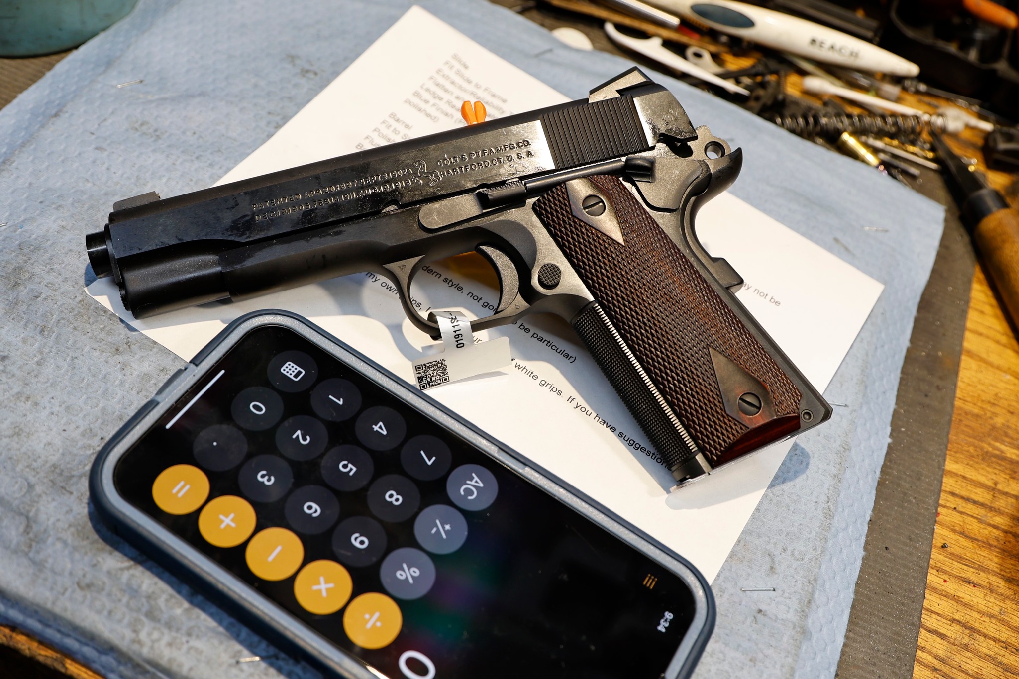 Customized Colt 1911 pistol with vintage rollmarks and modern upgrades